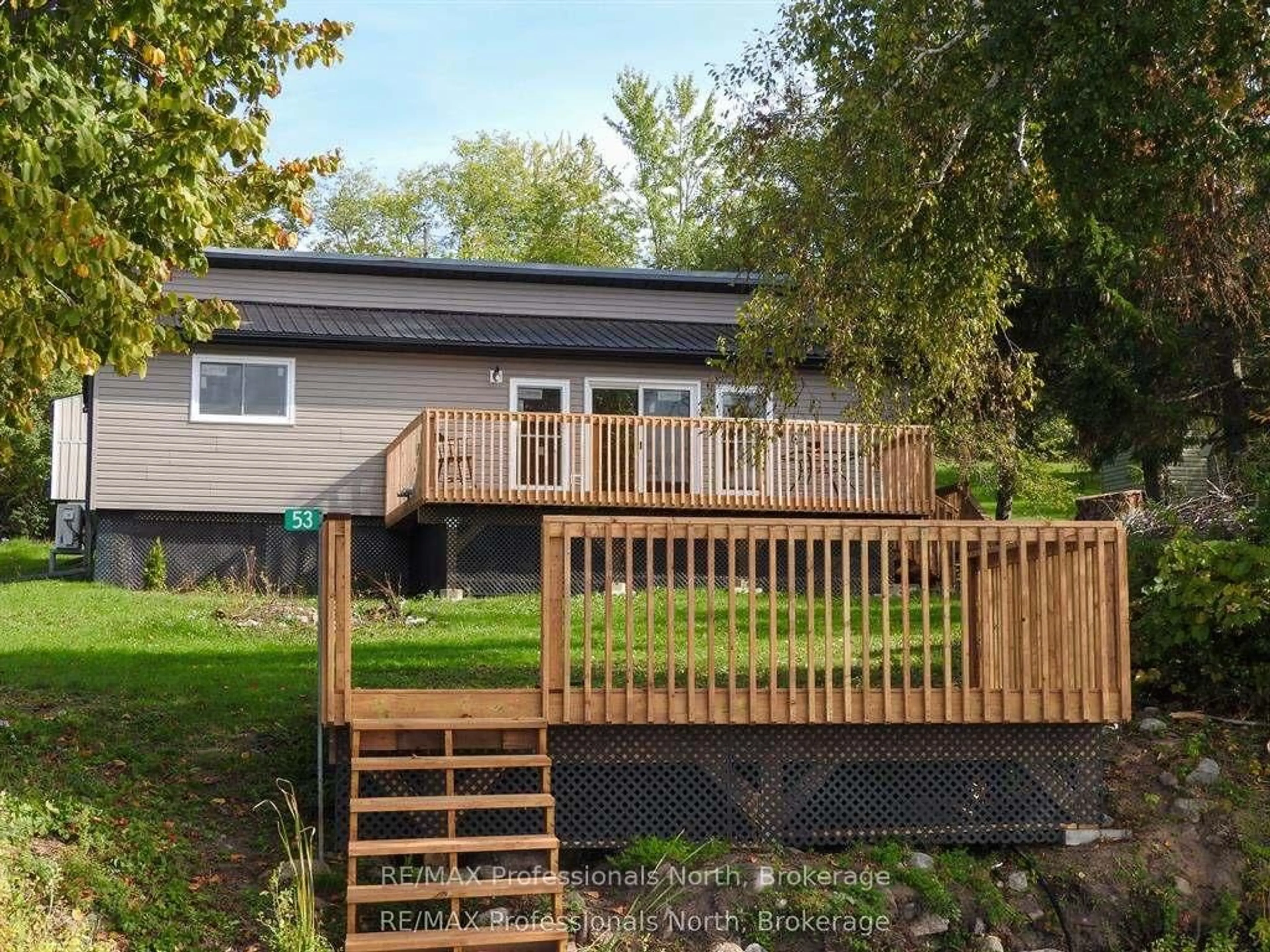A pic from outside/outdoor area/front of a property/back of a property/a pic from drone, unknown for 53 Long Island, Otonabee-South Monaghan Ontario K0L 1B0