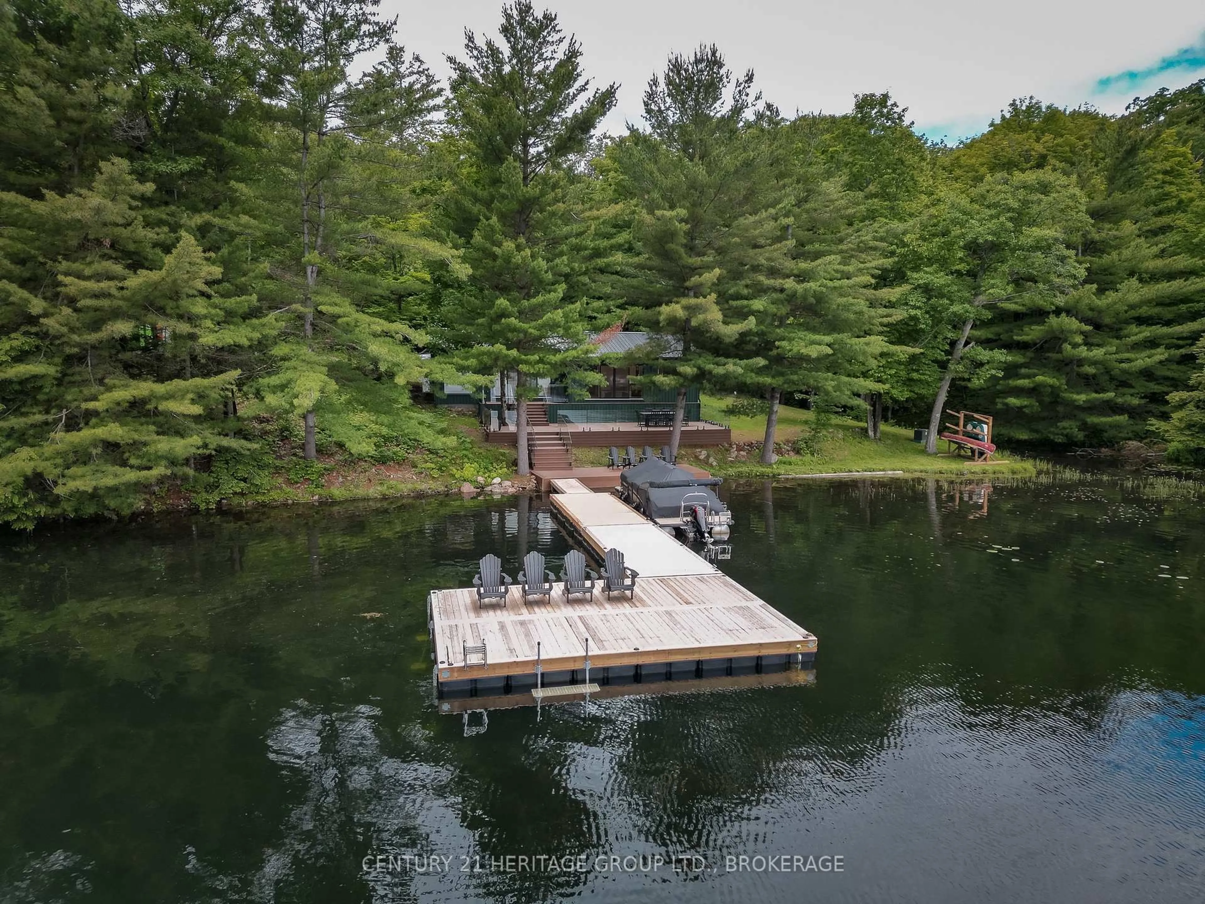 A pic from outside/outdoor area/front of a property/back of a property/a pic from drone, water/lake/river/ocean view for 1452 Leggat Lake Rd, Parham Ontario K0H 2K0