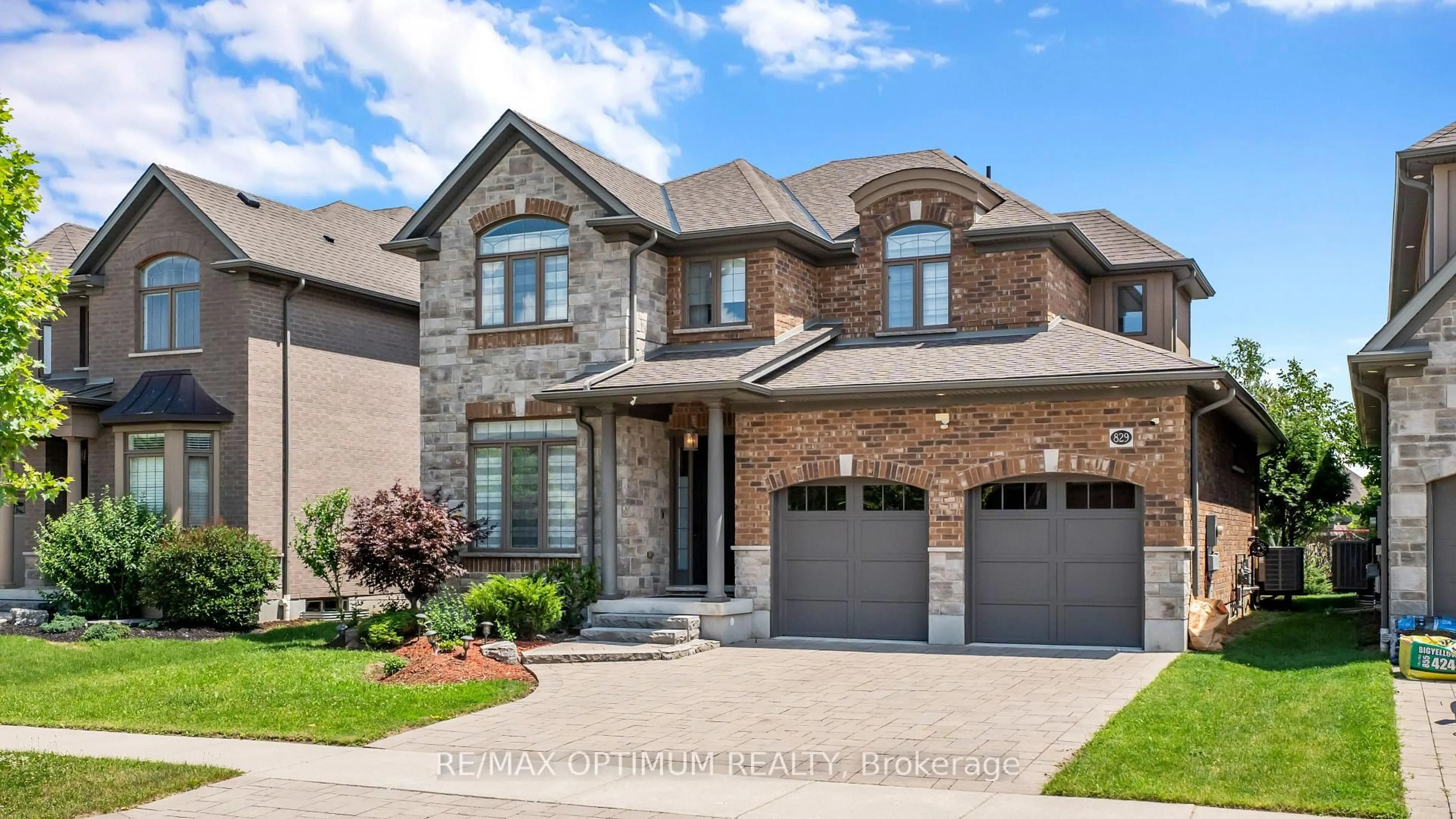 Home with brick exterior material, street for 829 COPPER RIDGE Dr, Waterloo Ontario N2K 0B5