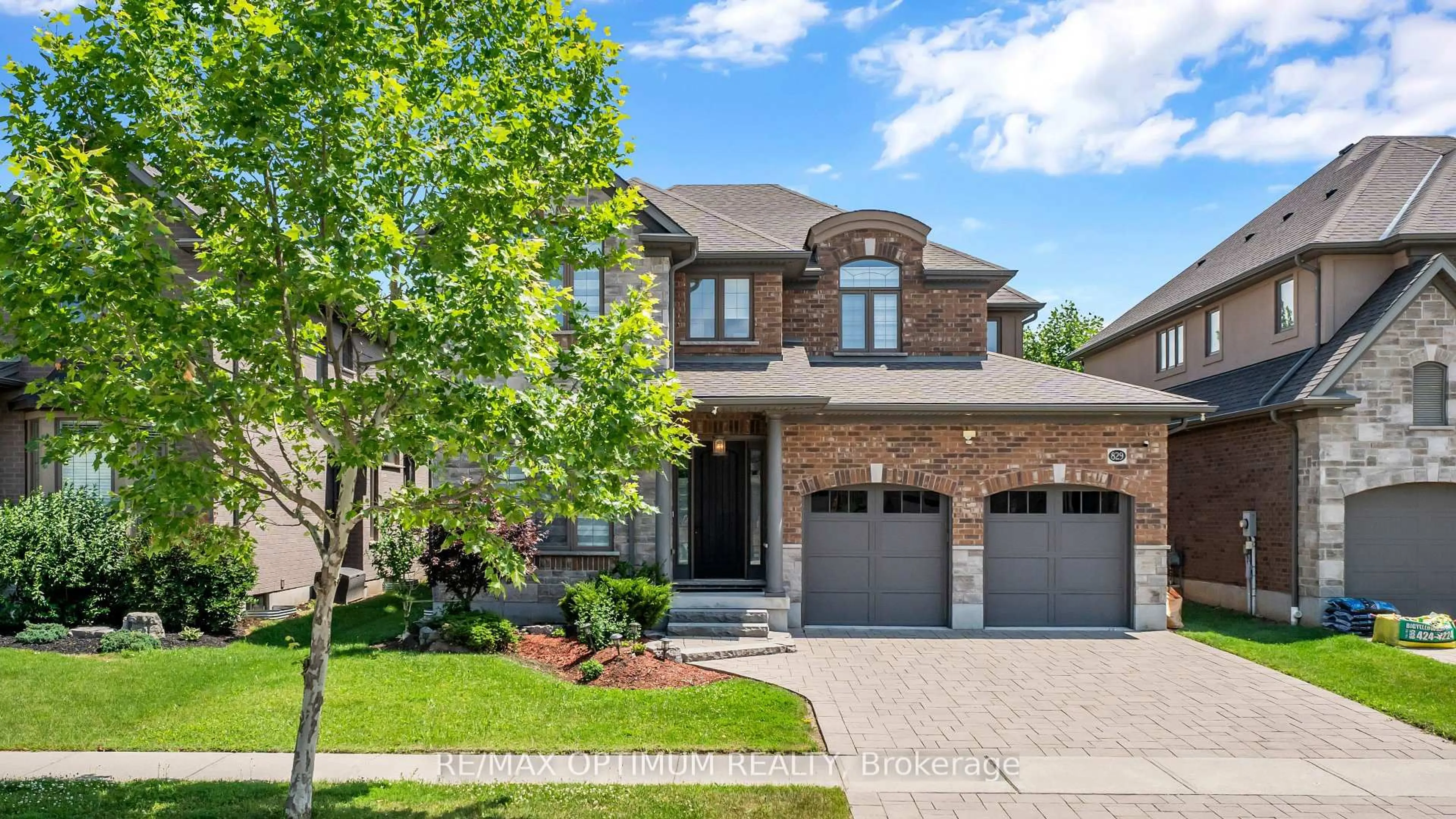 Home with brick exterior material, street for 829 COPPER RIDGE Dr, Waterloo Ontario N2K 0B5