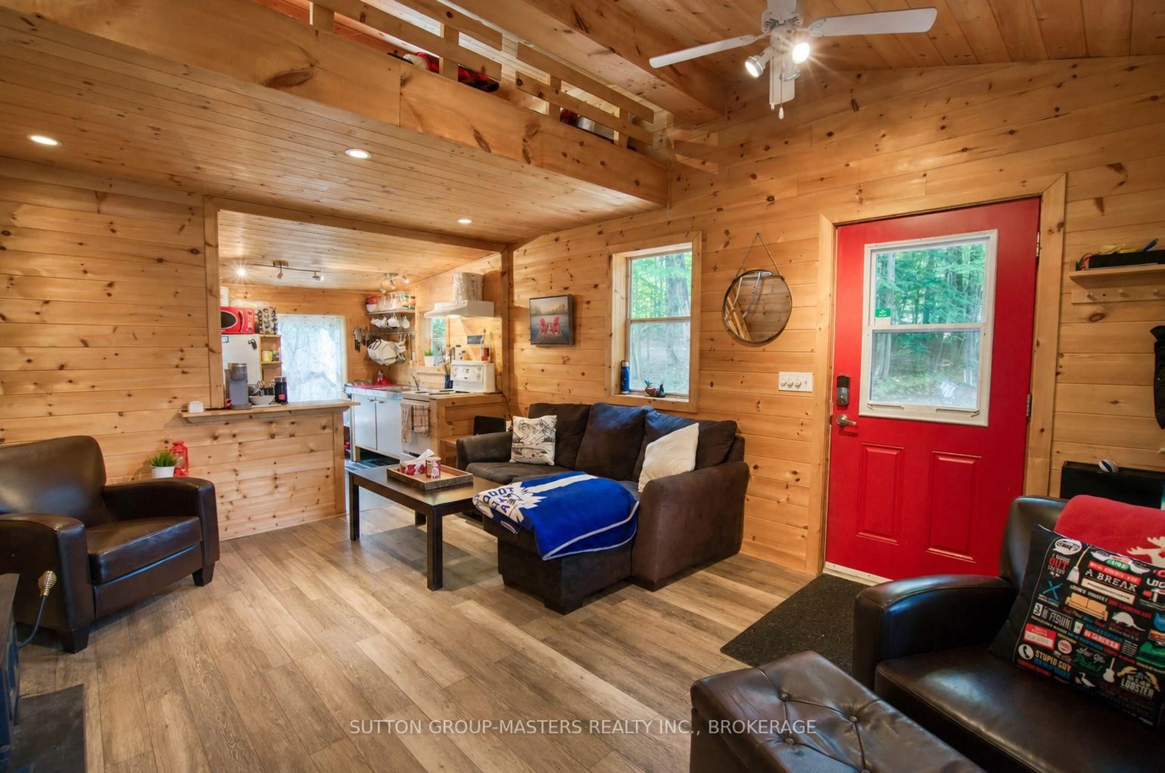 Living room with furniture, wood/laminate floor for 2282 Myers Cave Rd, Cloyne Ontario K0H 1K0