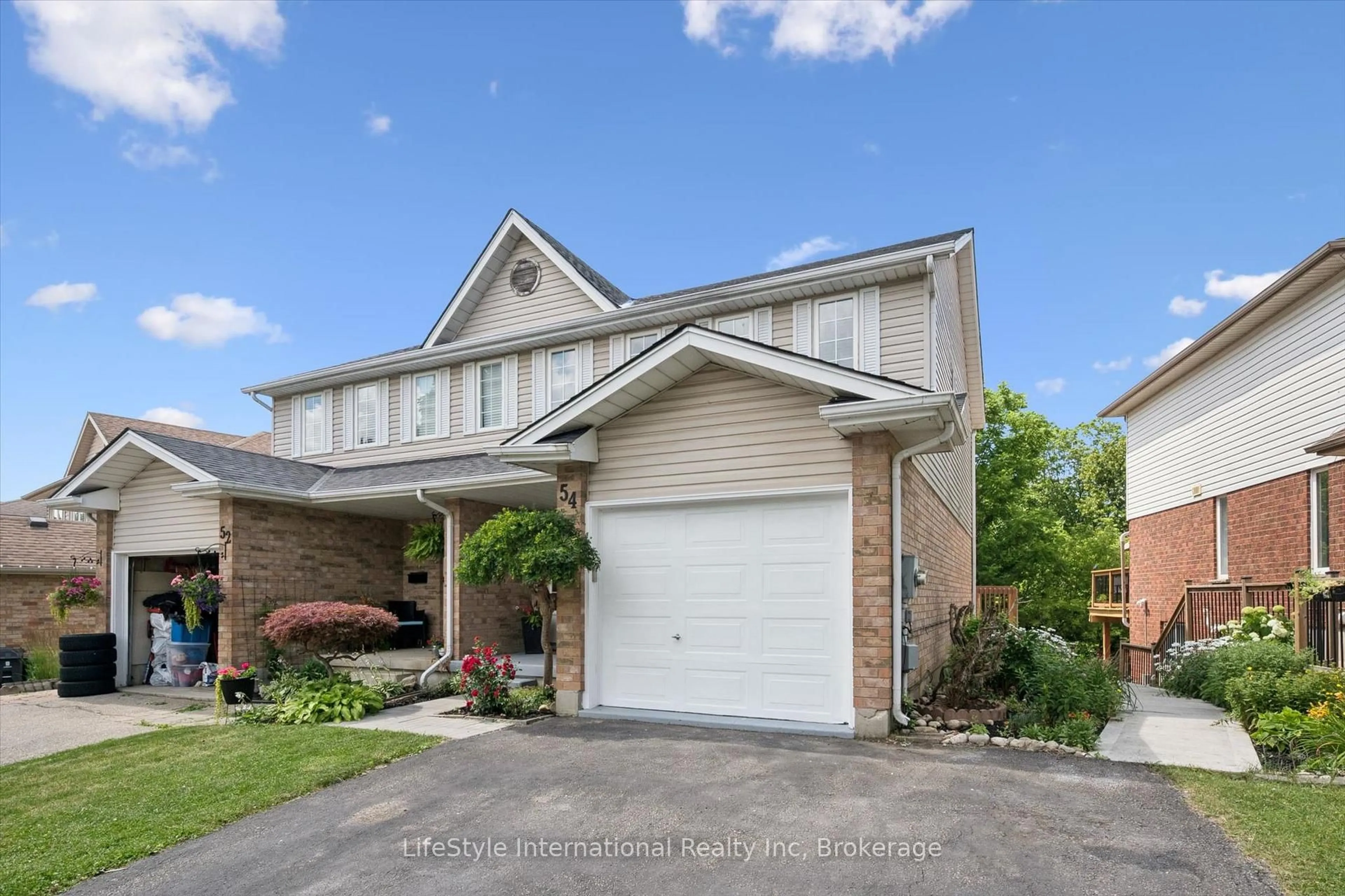 Home with brick exterior material, street for 54 Chesterton Lane, Guelph Ontario N1E 6S8
