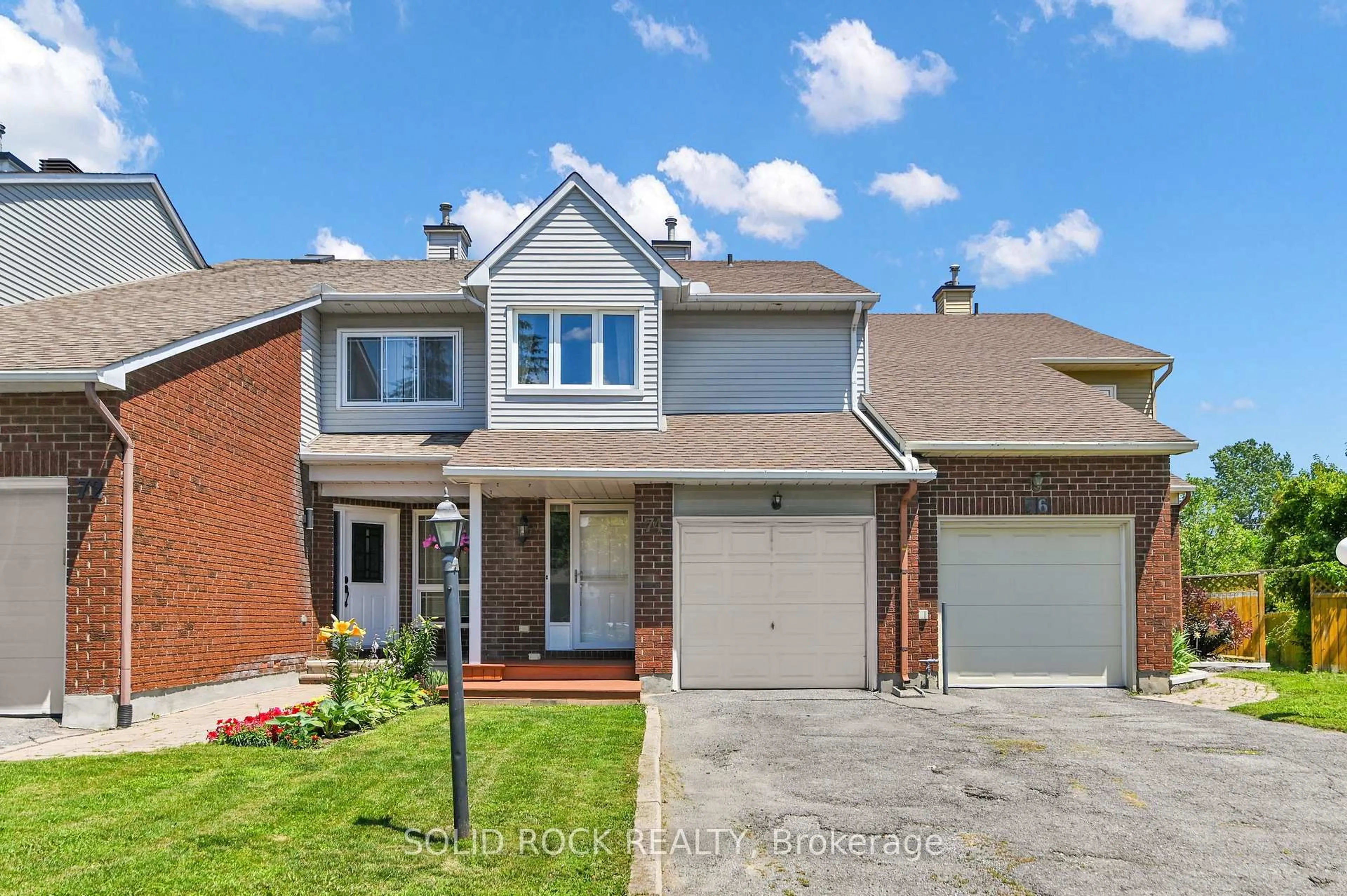 Home with brick exterior material, street for 74 Pickwick Dr, Barrhaven Ontario K2J 3E1