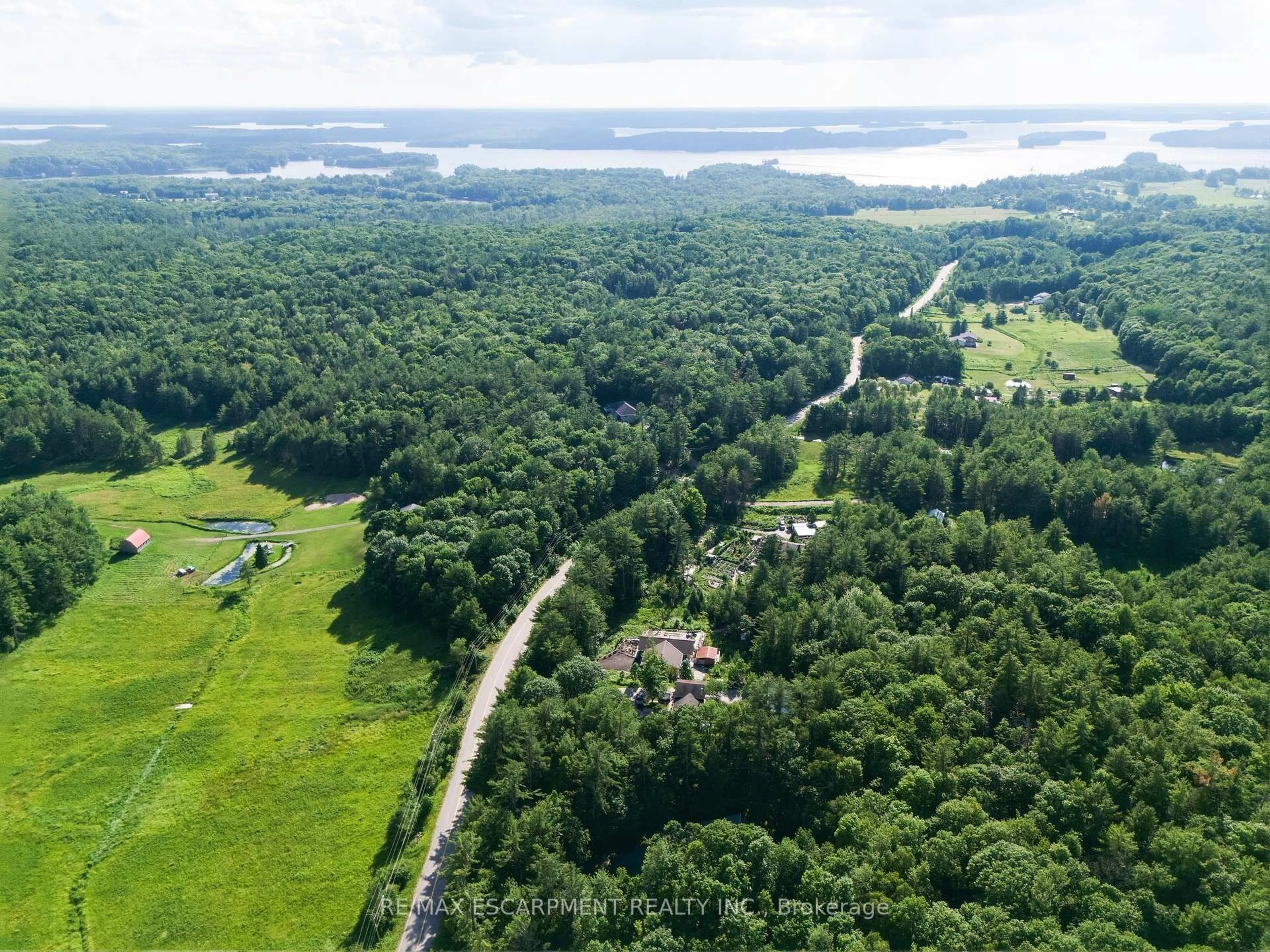A pic from outside/outdoor area/front of a property/back of a property/a pic from drone, forest/trees view for 1060 Golden Beach Rd, Bracebridge Ontario P1L 1W8