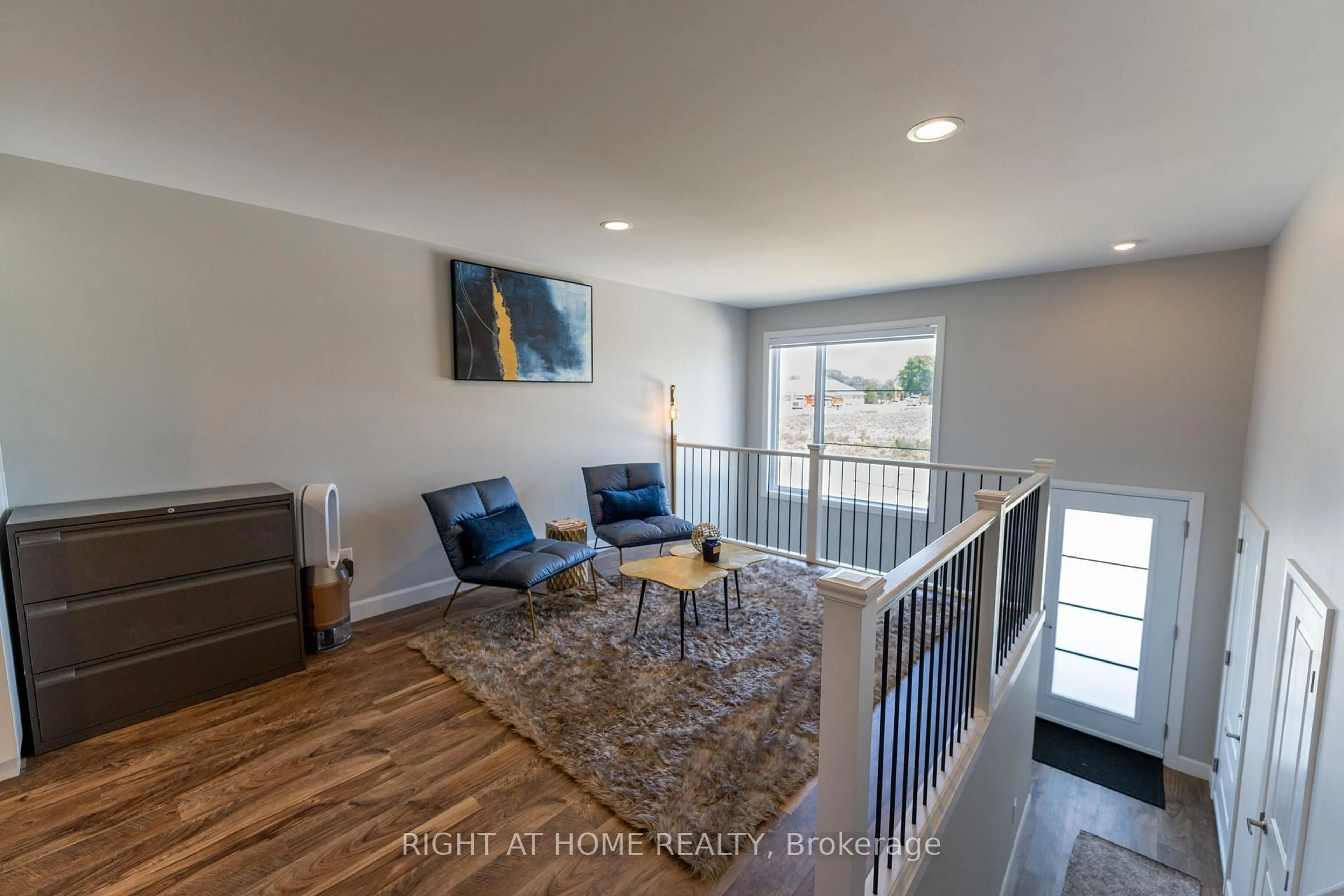 Living room with furniture, wood/laminate floor for 115 Howard Rd, Chatham-Kent Ontario N7M 0A4