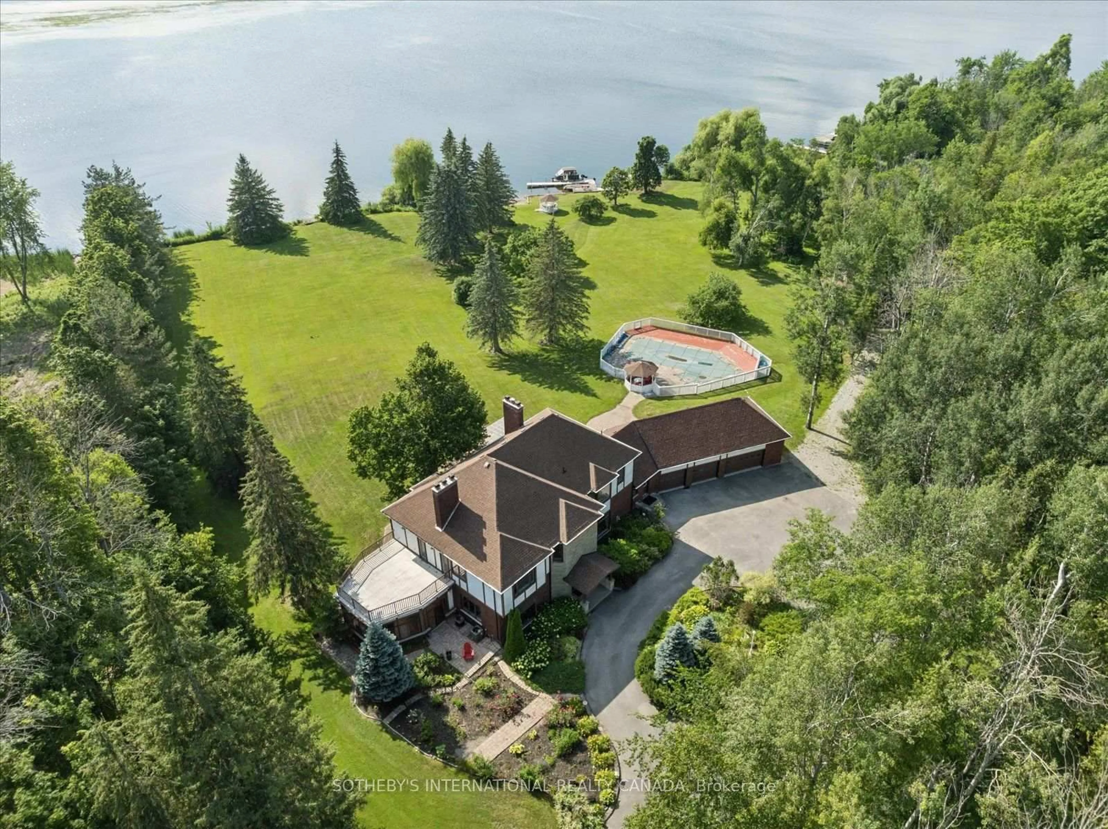 A pic from outside/outdoor area/front of a property/back of a property/a pic from drone, water/lake/river/ocean view for 1515 Hawkswood Dr, Selwyn Ontario K0L 1T0