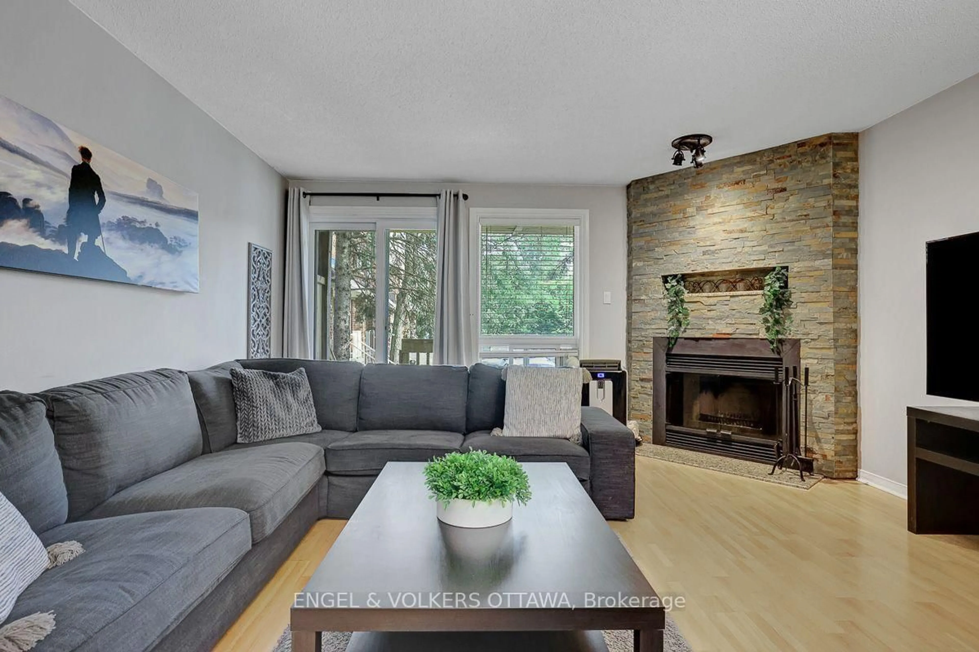 Living room with furniture, wood/laminate floor for 382 Briston Private, Ottawa Ontario K1G 5R2