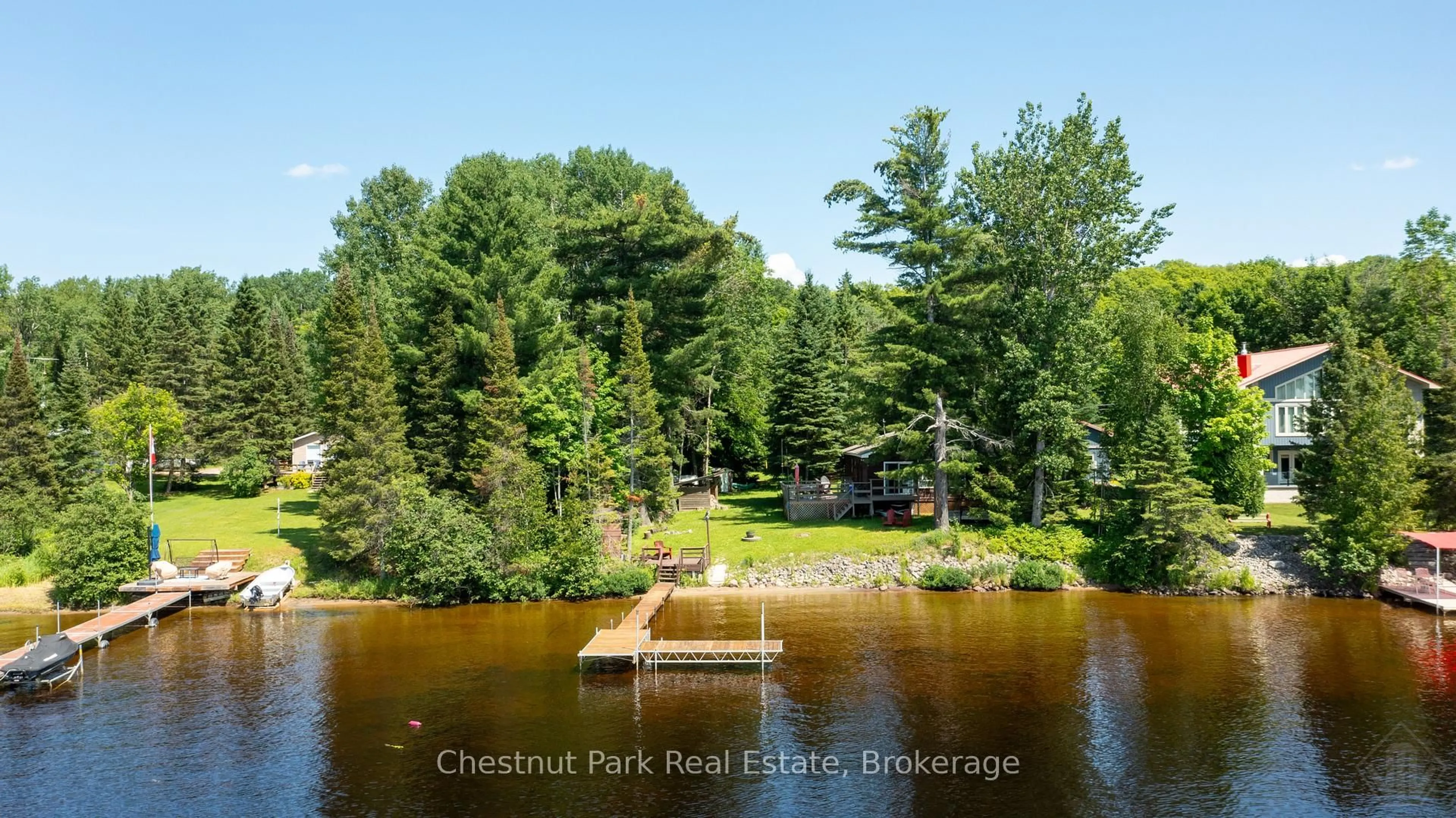 A pic from outside/outdoor area/front of a property/back of a property/a pic from drone, water/lake/river/ocean view for 254 Chapman Dr, Magnetawan Ontario P0A 1P0