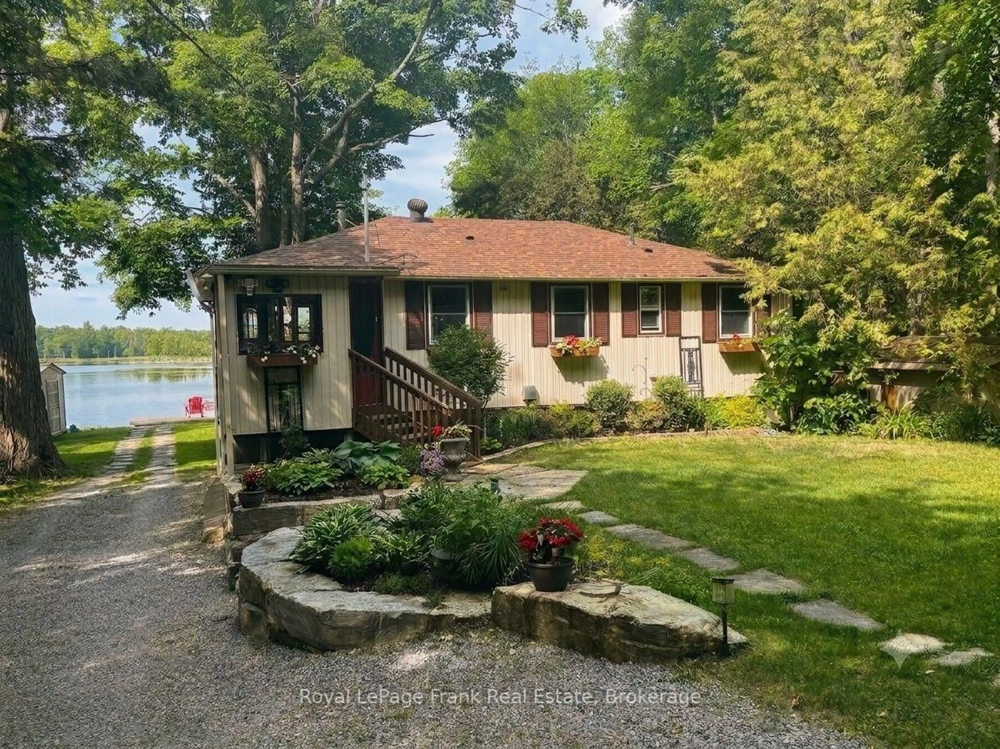 A pic from outside/outdoor area/front of a property/back of a property/a pic from drone, water/lake/river/ocean view for 12 Woodland Tr, Trent Lakes Ontario K0L 1J0