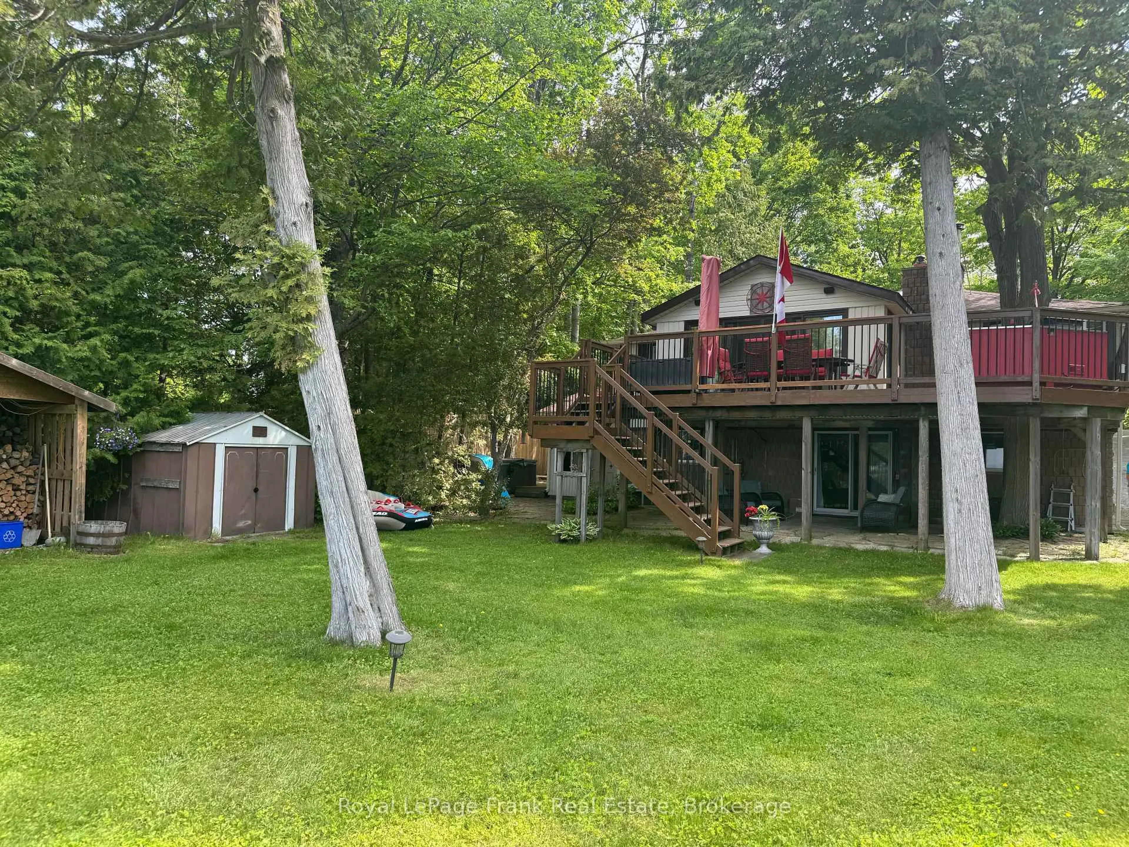 A pic from outside/outdoor area/front of a property/back of a property/a pic from drone, forest/trees view for 12 Woodland Tr, Trent Lakes Ontario K0L 1J0