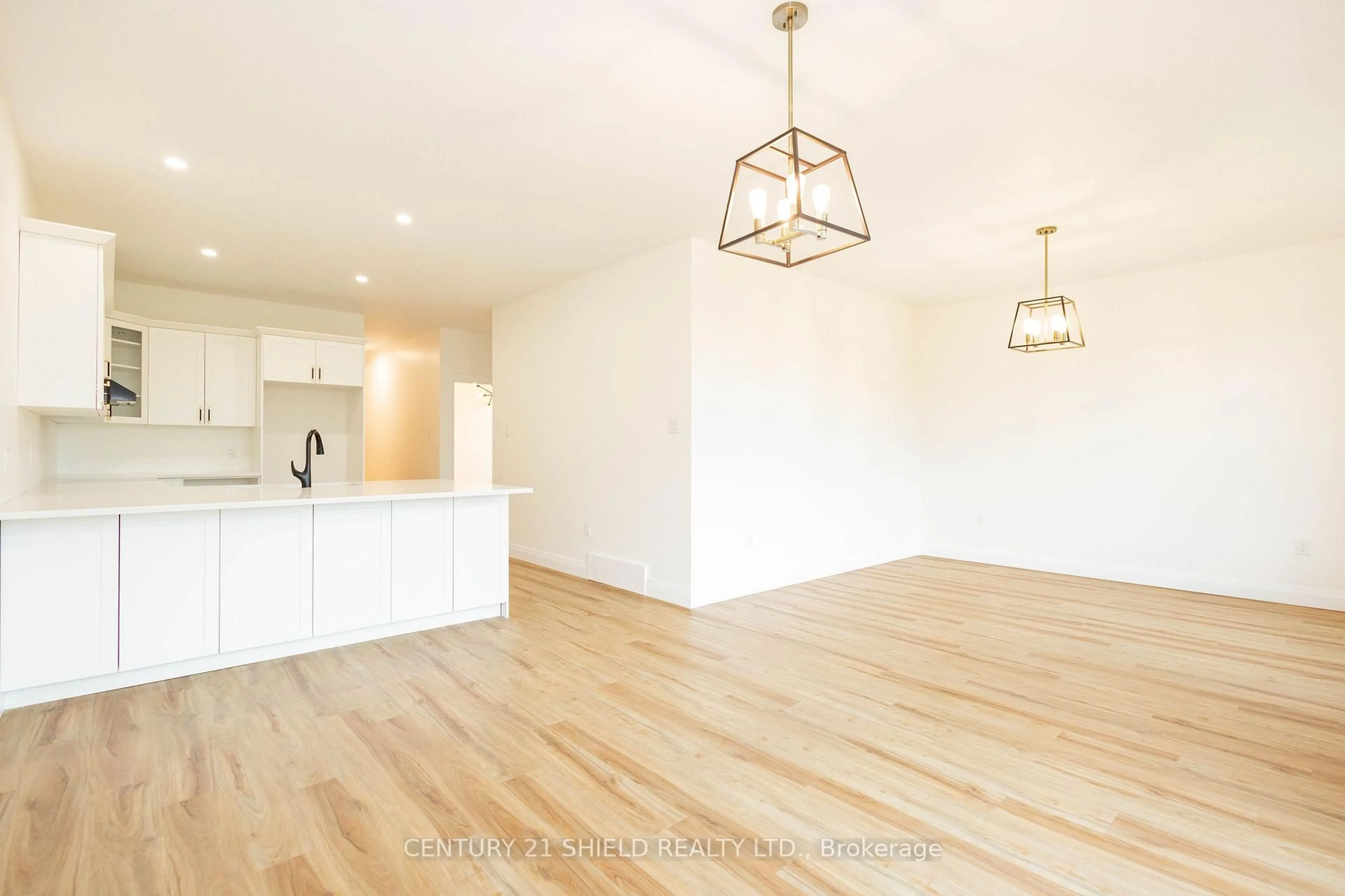 Open concept kitchen, wood/laminate floor for 2288 Crewson Crt, Cornwall Ontario K6H 0H5