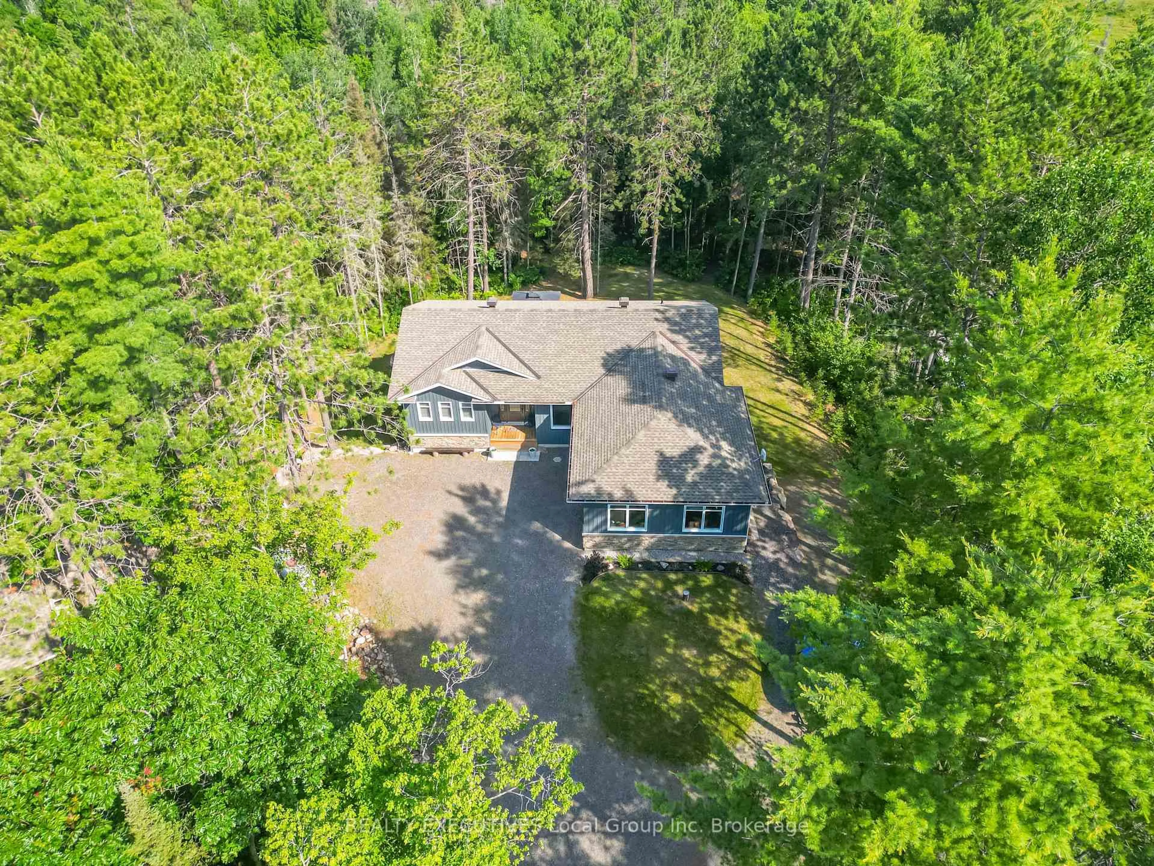 A pic from outside/outdoor area/front of a property/back of a property/a pic from drone, forest/trees view for 87 Oakridge Dr, East Ferris Ontario P0H 1K0