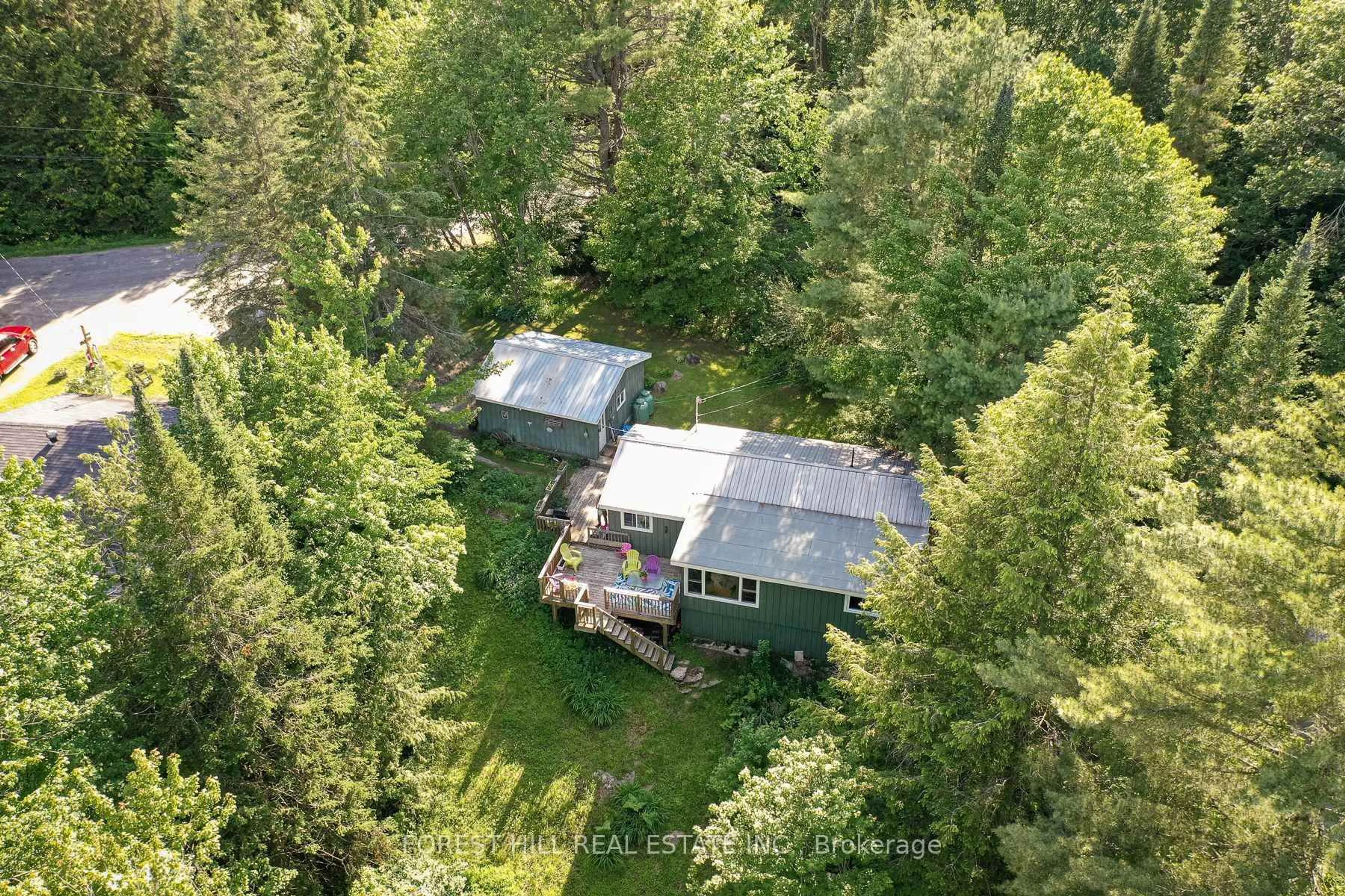 A pic from outside/outdoor area/front of a property/back of a property/a pic from drone, forest/trees view for 183 Bonnell Rd, Bracebridge Ontario P1L 0M1