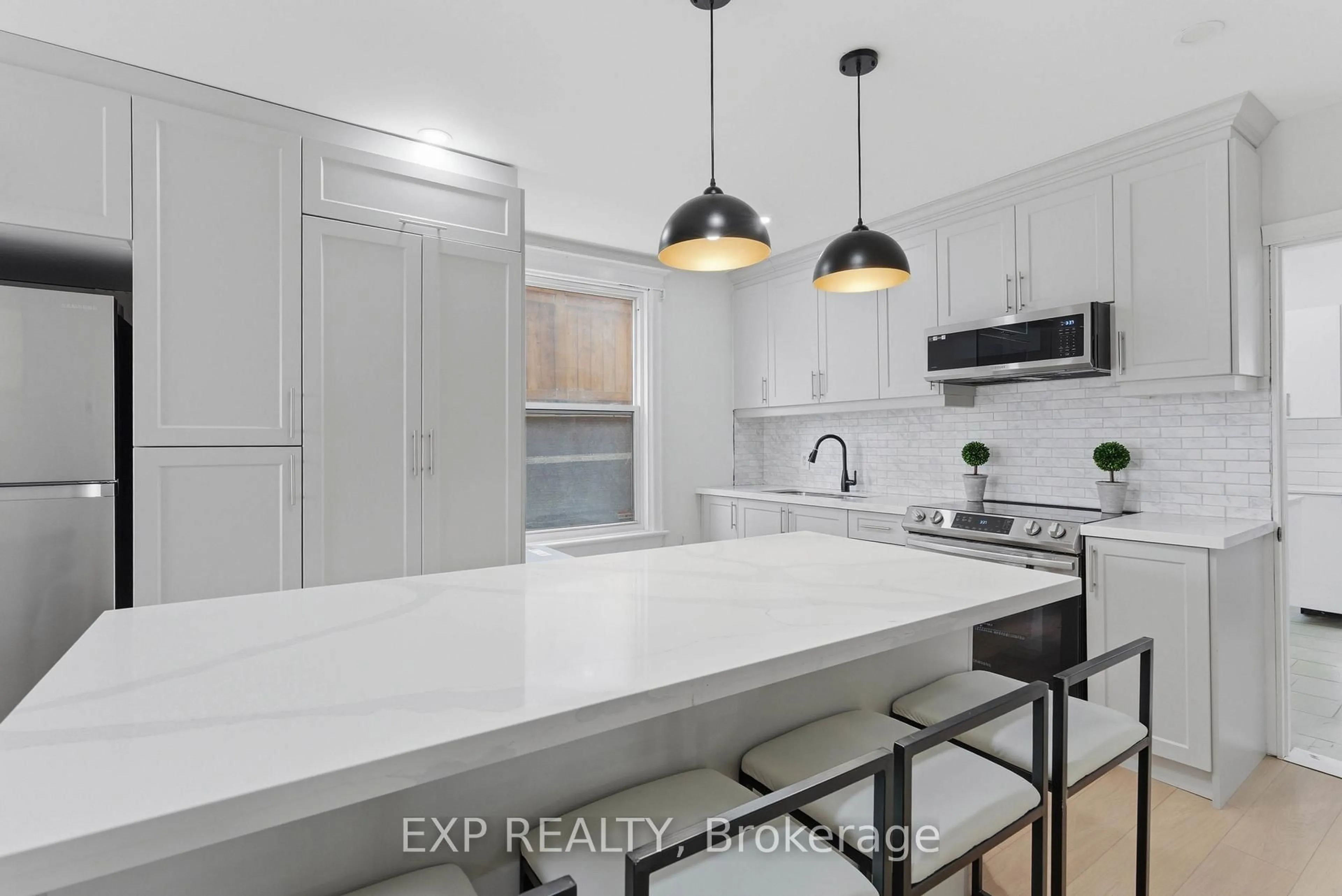 Open concept kitchen, ceramic/tile floor for 191 Queen St, Hamilton Ontario L2E 7K8