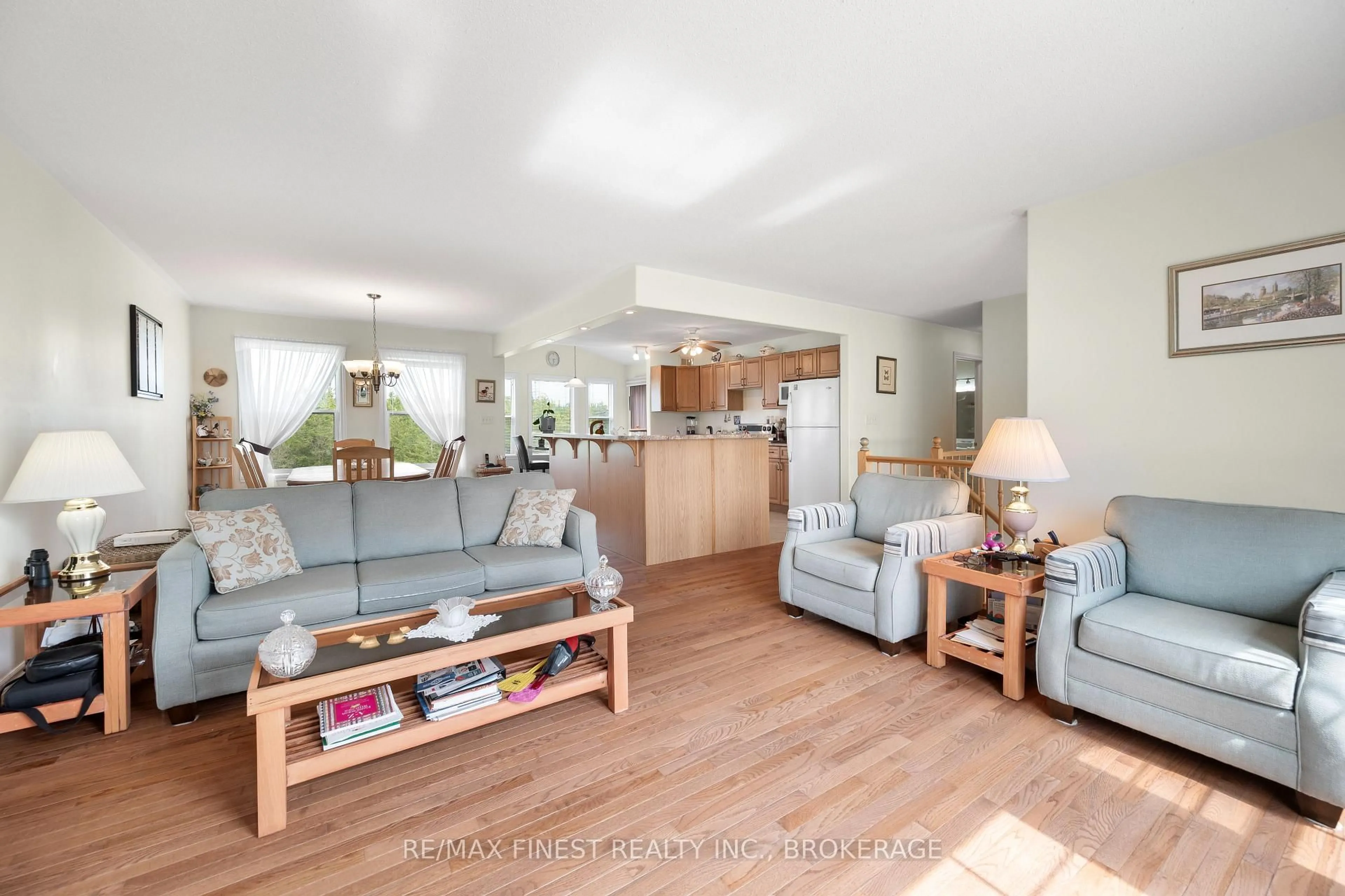 Living room with furniture, wood/laminate floor for 245 Pleasant Dr, Greater Napanee Ontario K0K 2Z0
