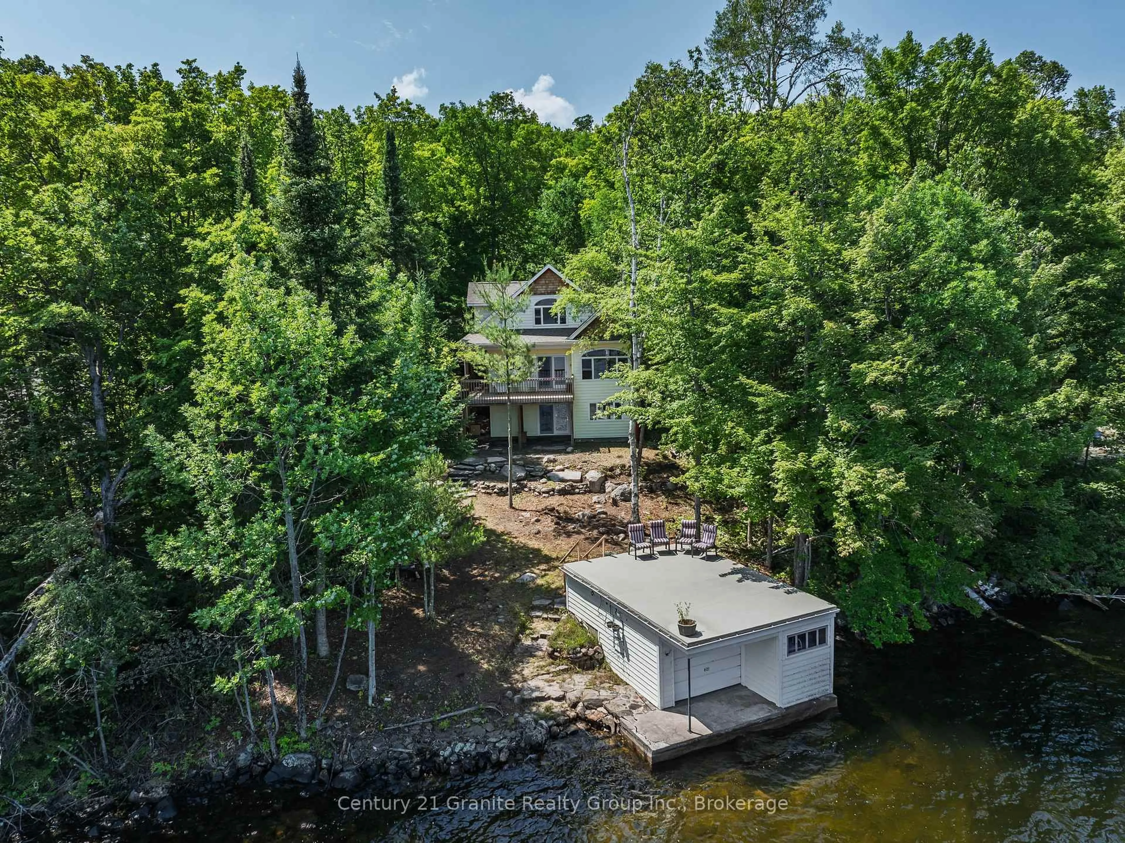 A pic from outside/outdoor area/front of a property/back of a property/a pic from drone, water/lake/river/ocean view for 1014 Peekaboo Bay Lane, Dysart et al Ontario K0M 1S0