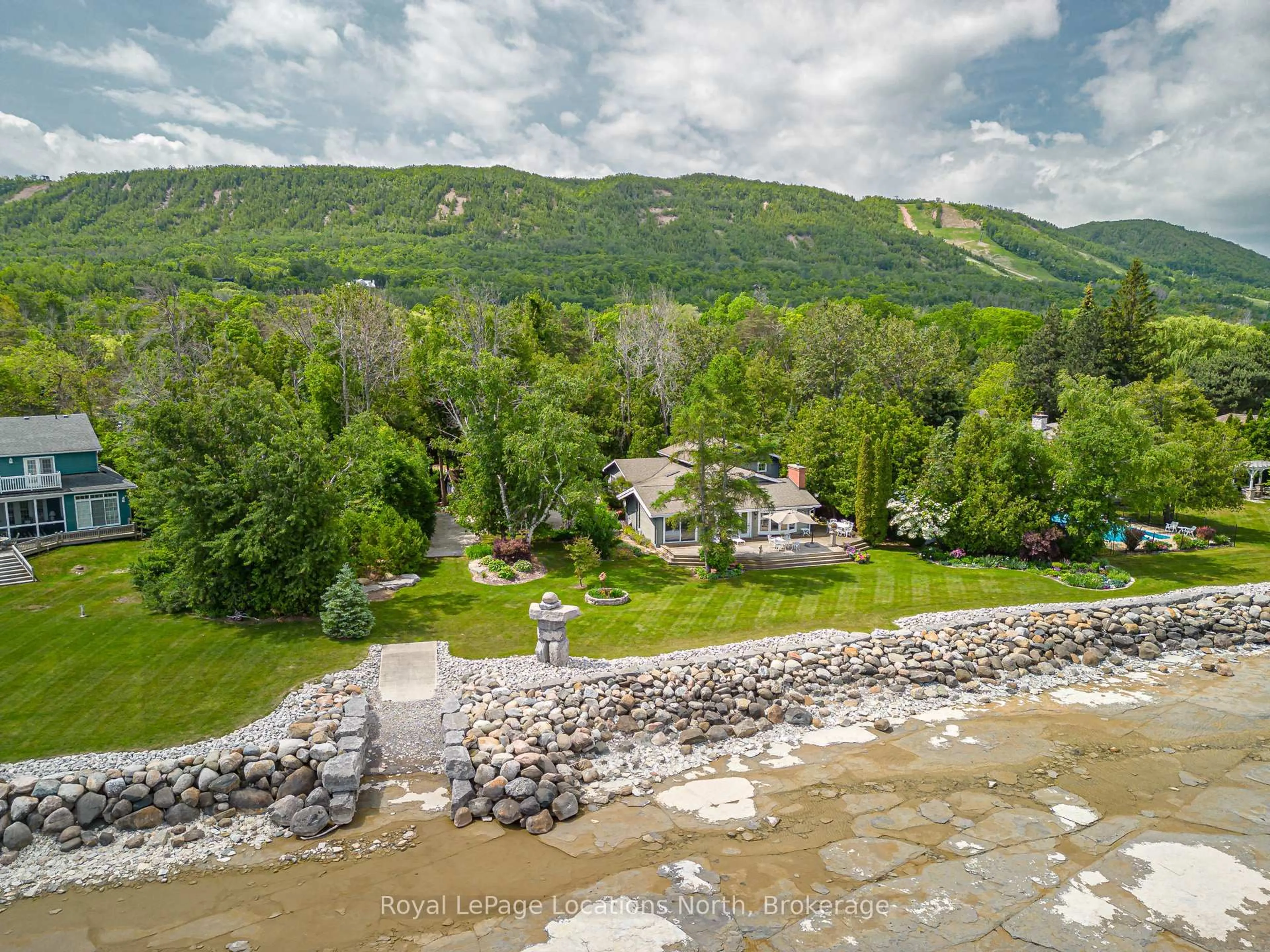 A pic from outside/outdoor area/front of a property/back of a property/a pic from drone, water/lake/river/ocean view for 209297 26 Highway, Blue Mountains Ontario L9Y 3Z2
