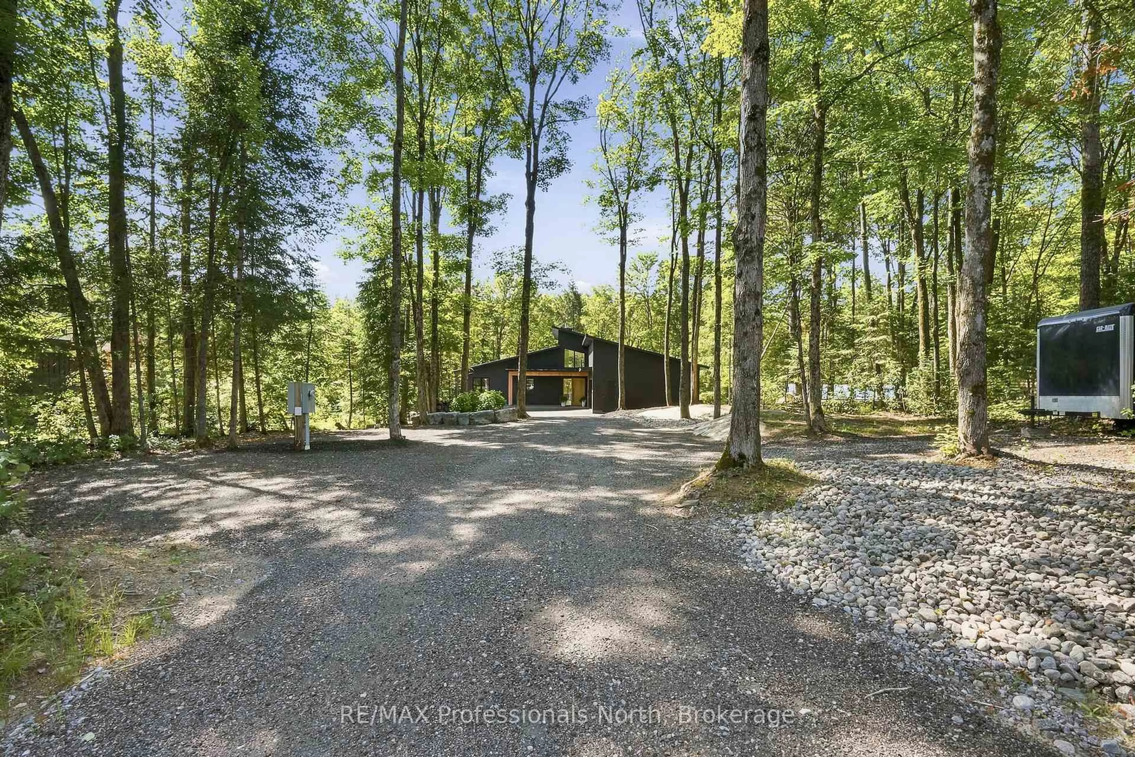 A pic from outside/outdoor area/front of a property/back of a property/a pic from drone, forest/trees view for 1192 High Falls Rd, Bracebridge Ontario P1L 0L1