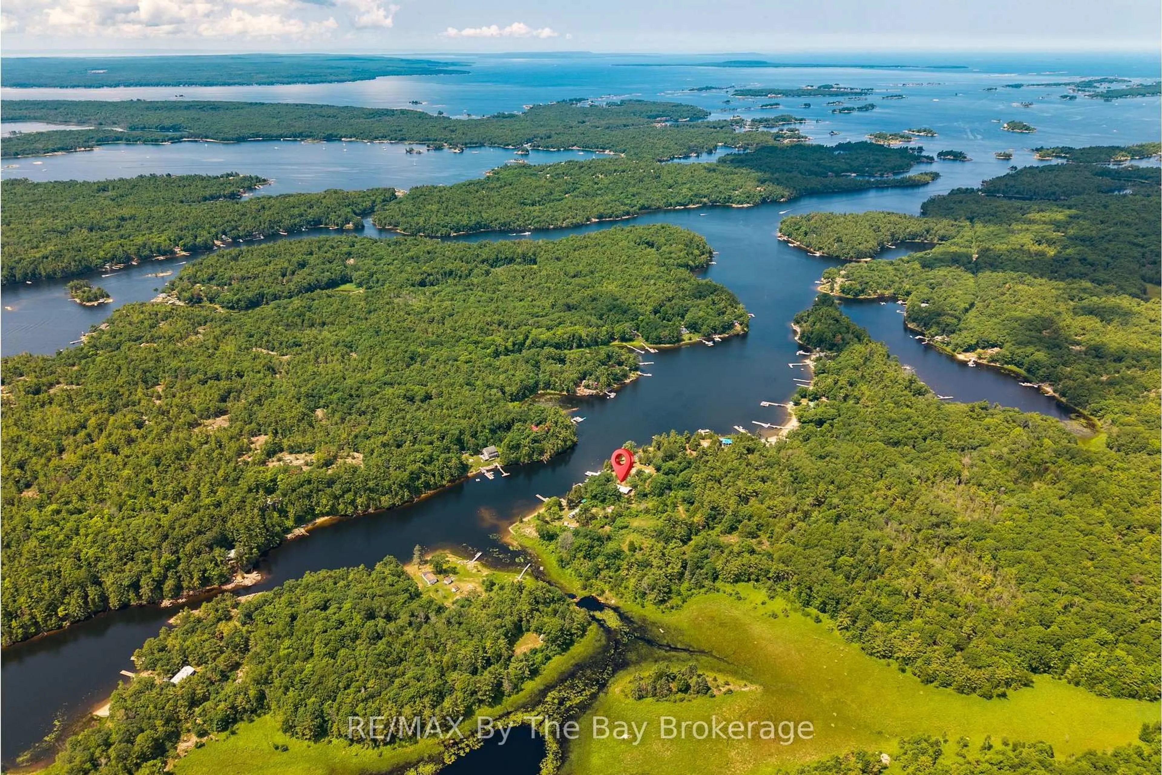 A pic from outside/outdoor area/front of a property/back of a property/a pic from drone, water/lake/river/ocean view for 13626 Georgian Bay Shore, Georgian Bay Ontario L0K 1S0