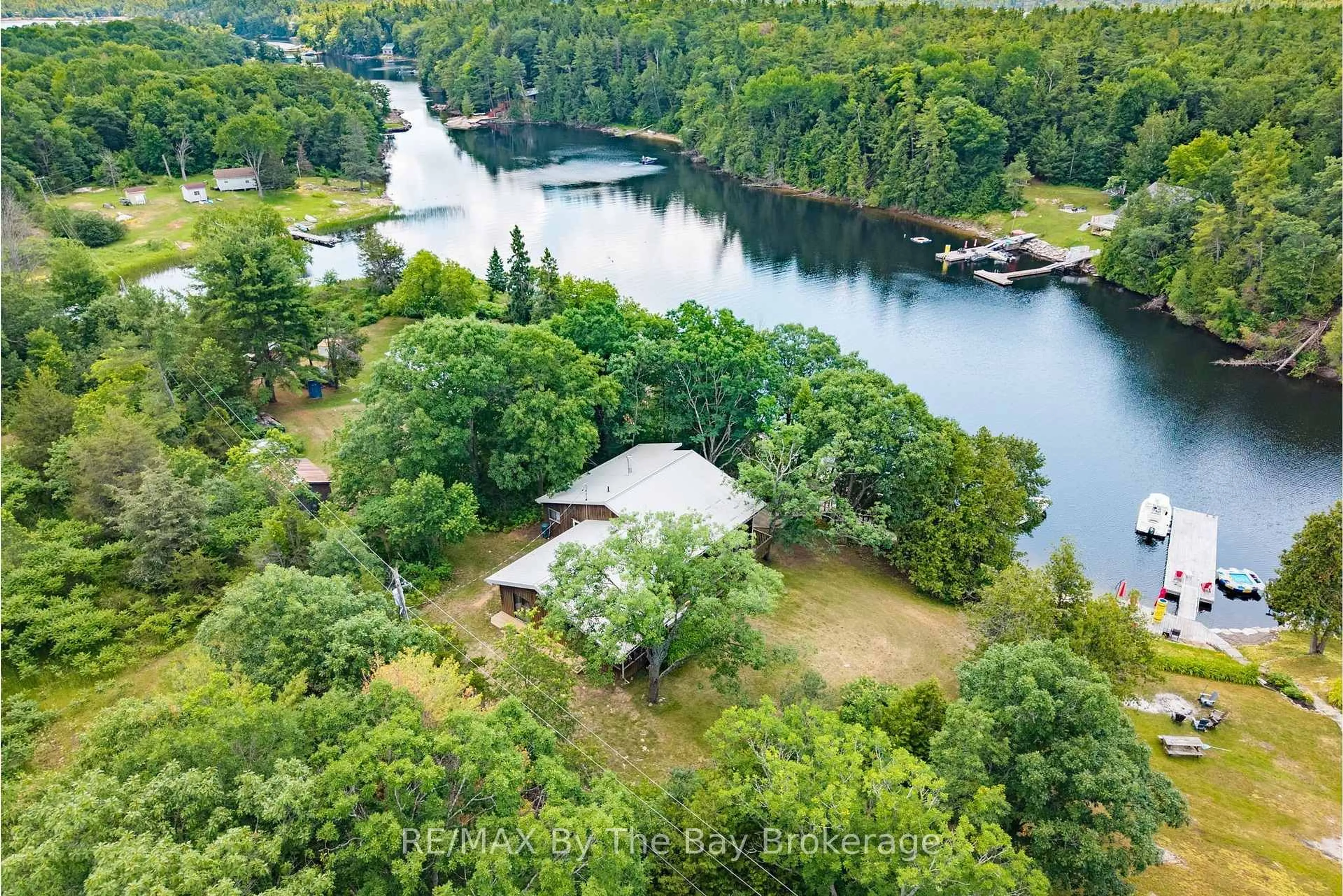 A pic from outside/outdoor area/front of a property/back of a property/a pic from drone, water/lake/river/ocean view for 13626 Georgian Bay Shore, Georgian Bay Ontario L0K 1S0