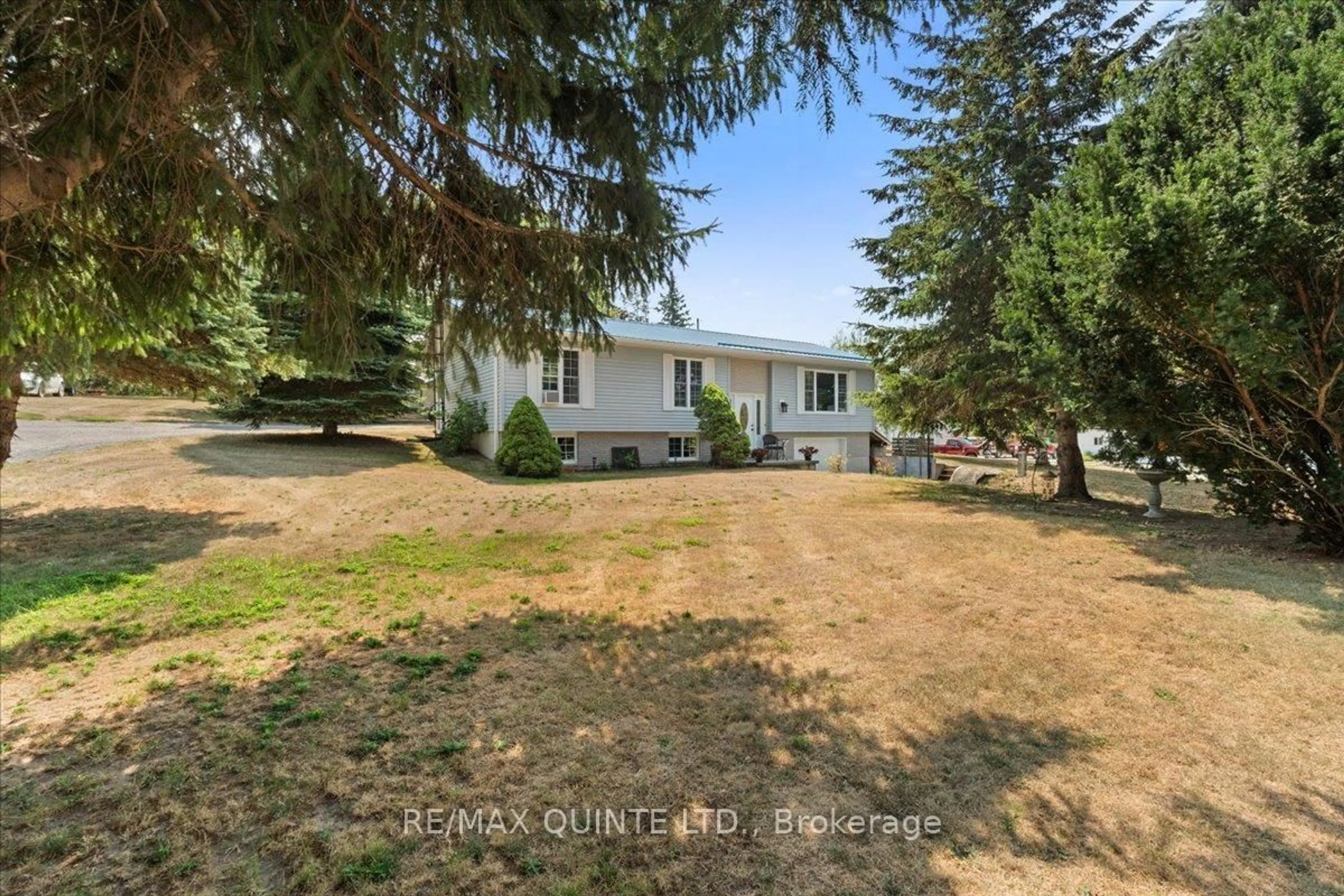A pic from outside/outdoor area/front of a property/back of a property/a pic from drone, street for 19 County Rd 18 Rd, Prince Edward County Ontario K0K 1P0