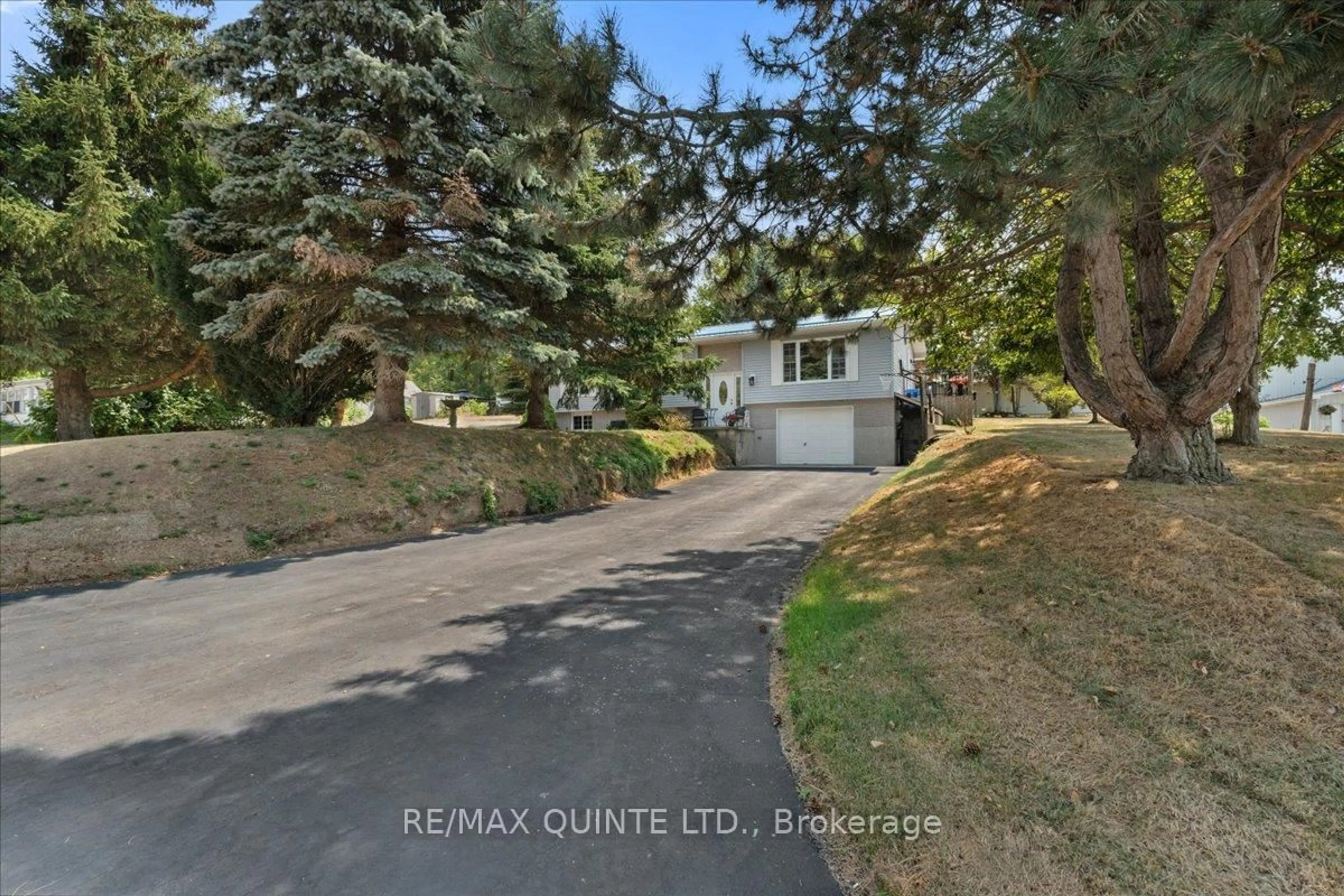 A pic from outside/outdoor area/front of a property/back of a property/a pic from drone, street for 19 County Rd 18 Rd, Prince Edward County Ontario K0K 1P0