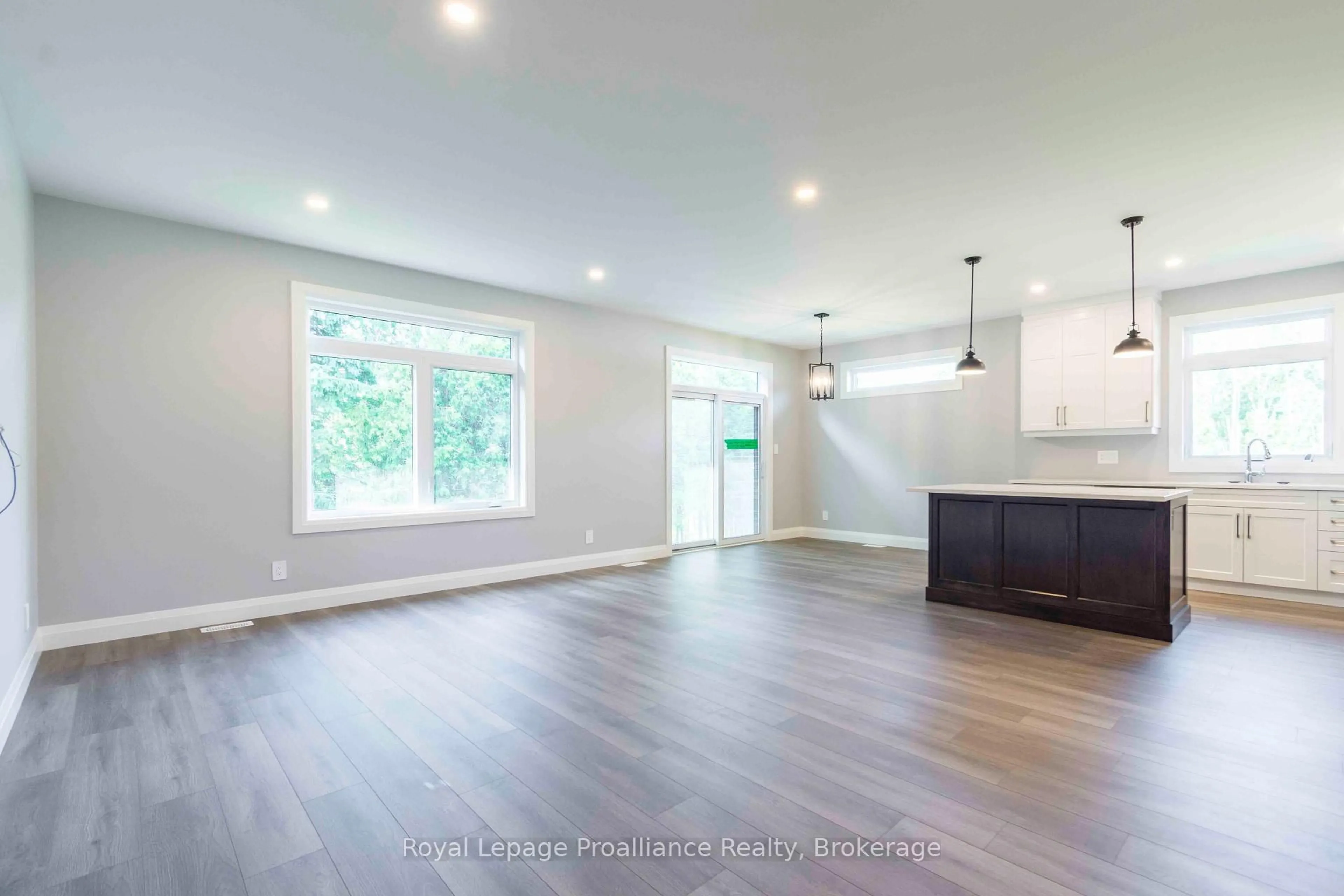 Open concept kitchen, wood/laminate floor for 31 MacKenzie John Cres, Brighton Ontario K0K 1H0