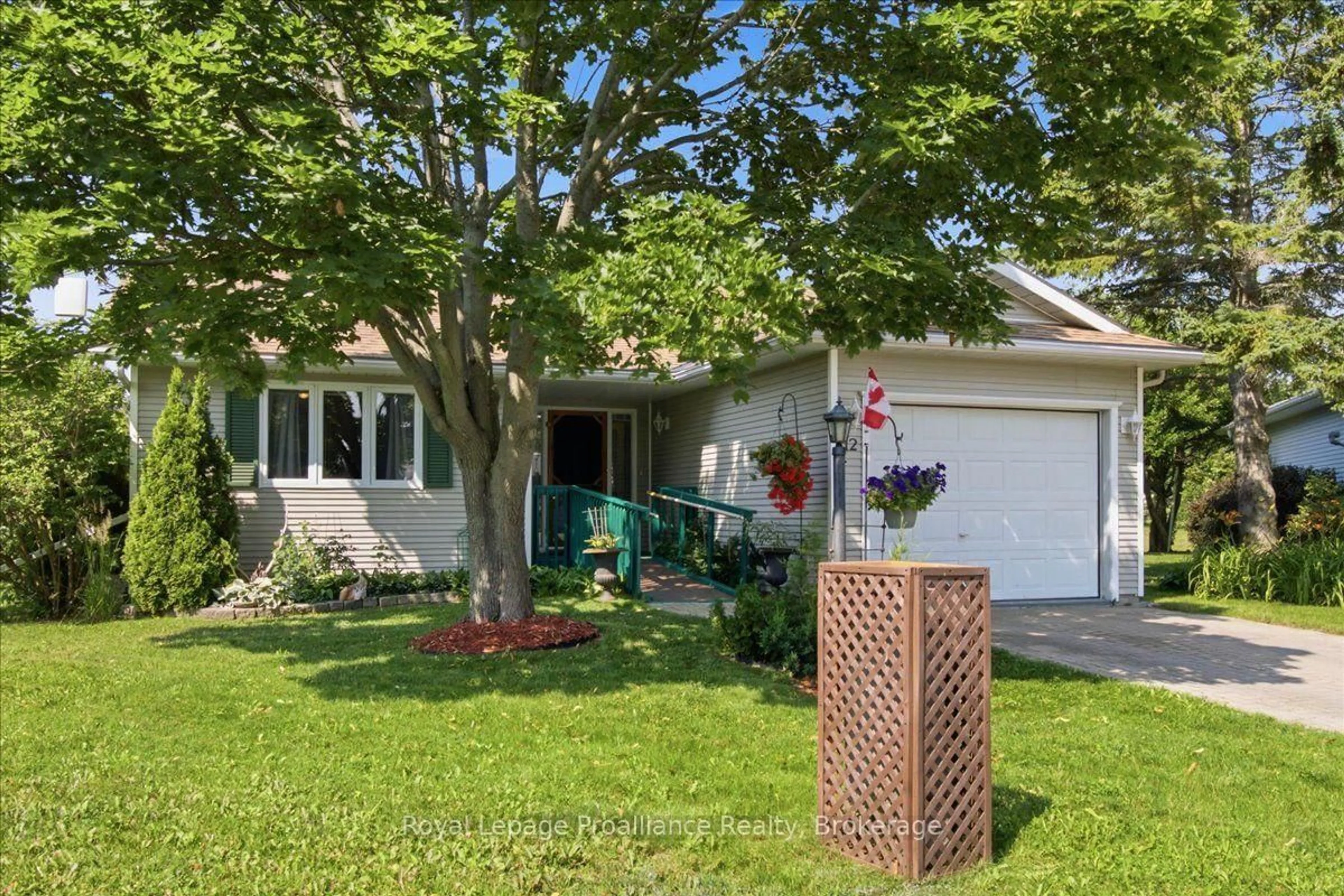 Home with vinyl exterior material, street for 12 Reynolds Pl, Prince Edward County Ontario K0K 3L0