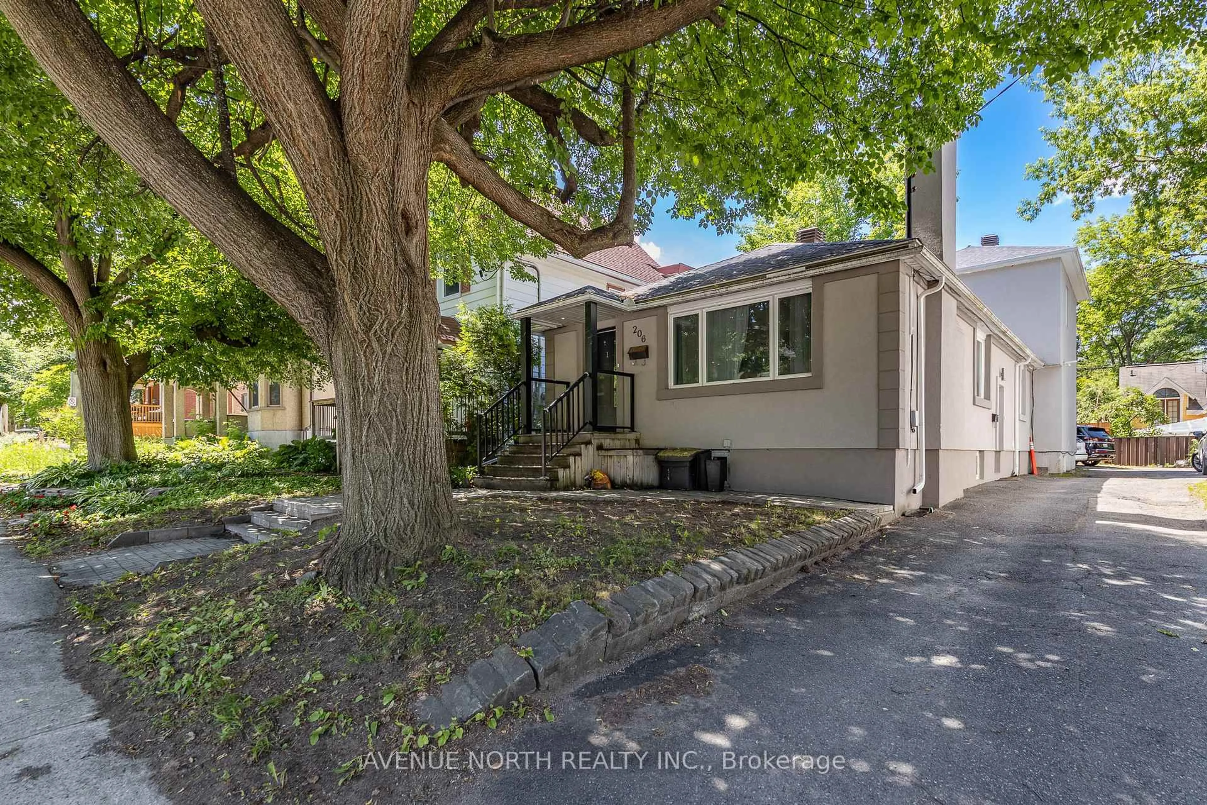 A pic from outside/outdoor area/front of a property/back of a property/a pic from drone, street for 206 Blackburn Ave, Ottawa Ontario K1N 8A8