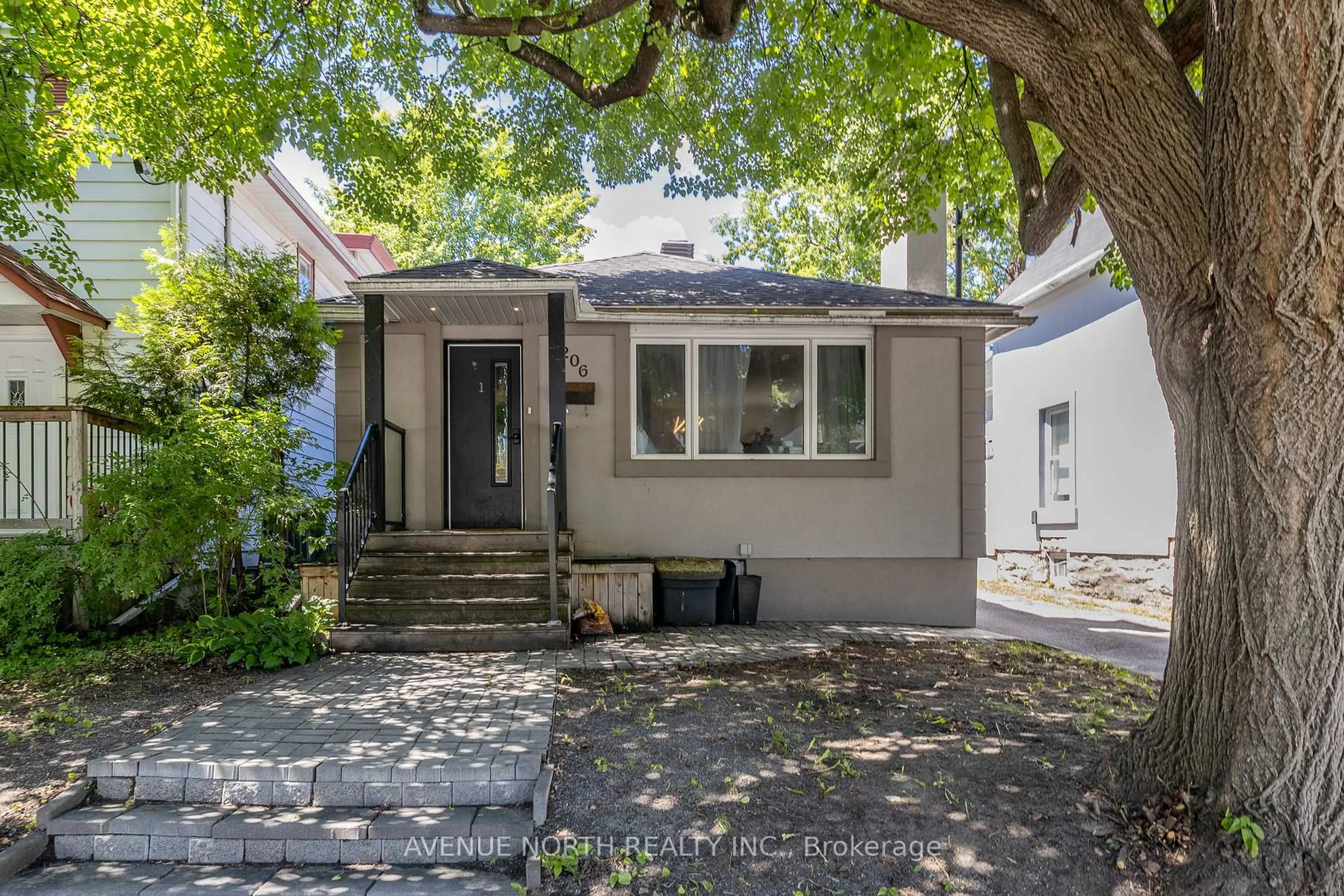 Home with vinyl exterior material, street for 206 Blackburn Ave, Ottawa Ontario K1N 8A8
