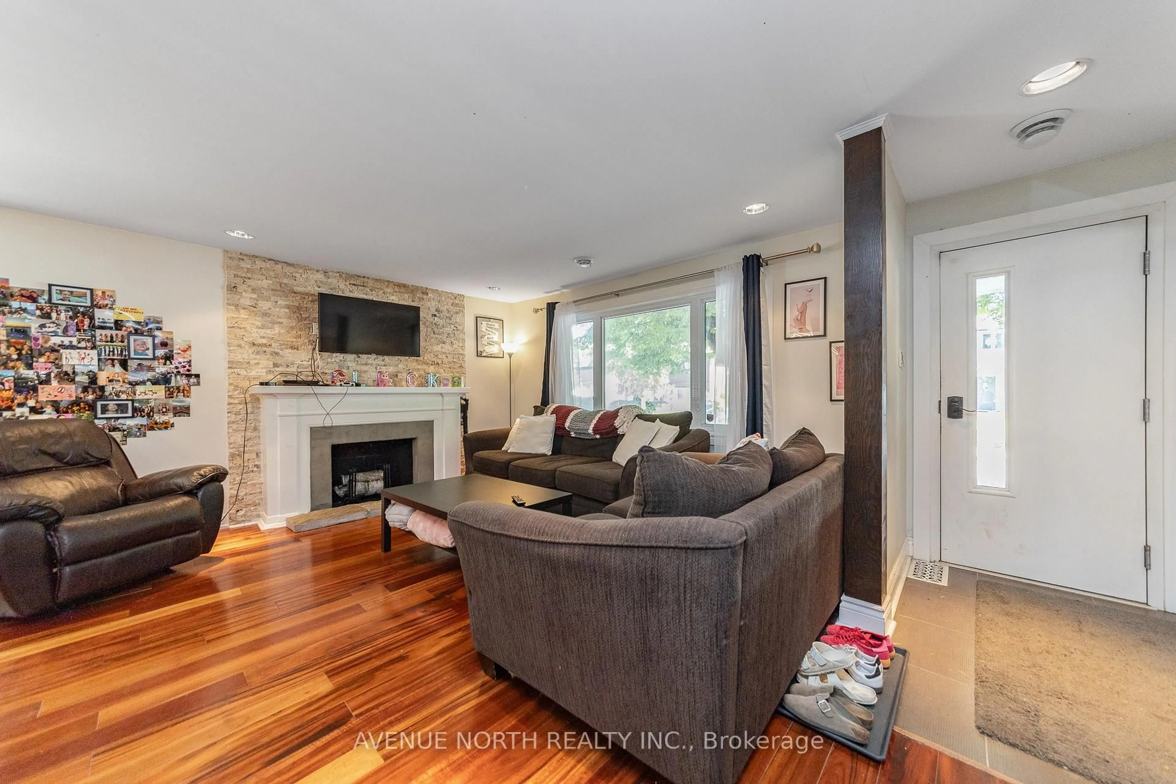 Living room with furniture, wood/laminate floor for 206 Blackburn Ave, Ottawa Ontario K1N 8A8