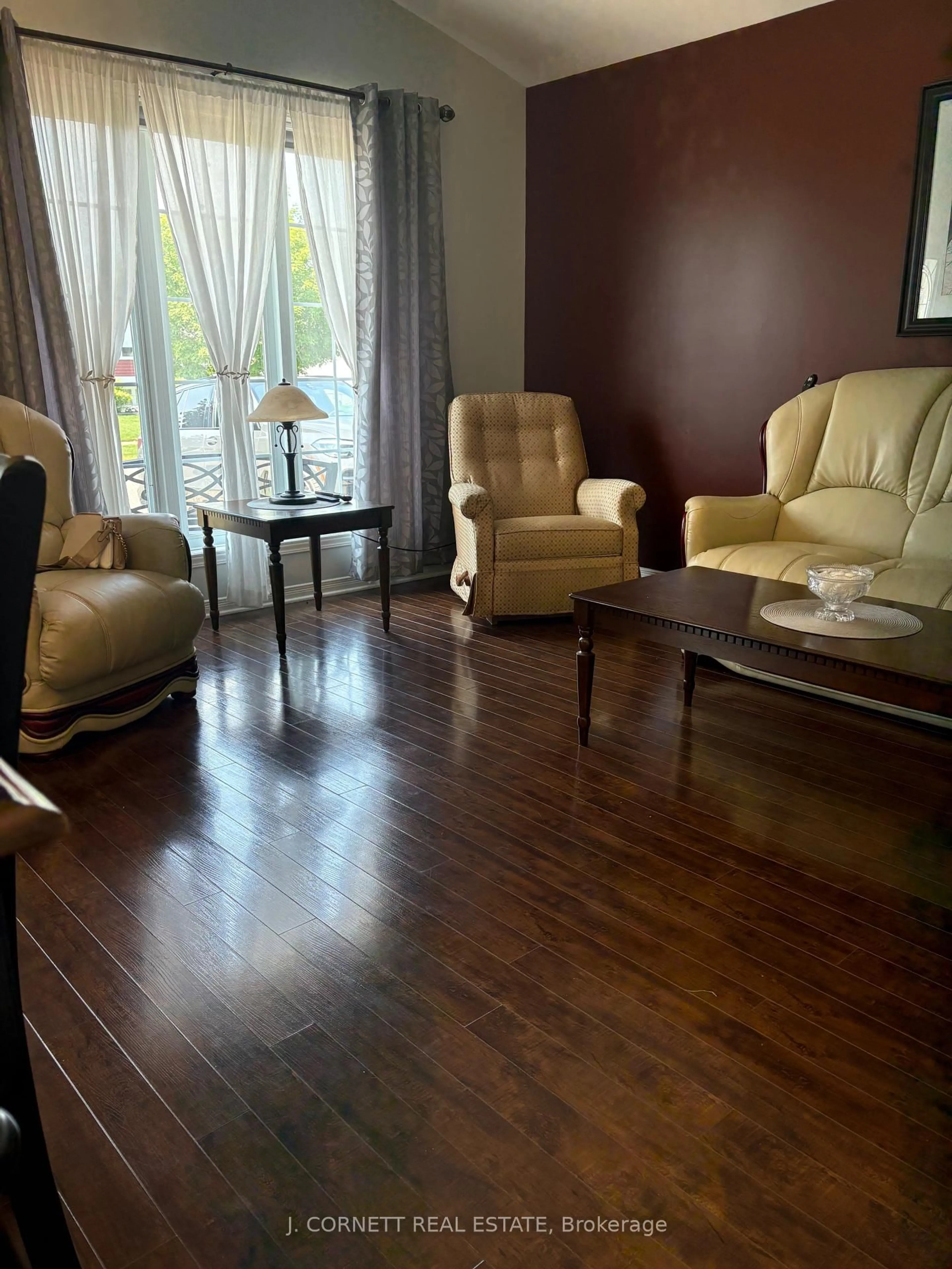 Living room with furniture, wood/laminate floor for 132 Dunbar Ave, Cornwall Ontario K6H 7P4