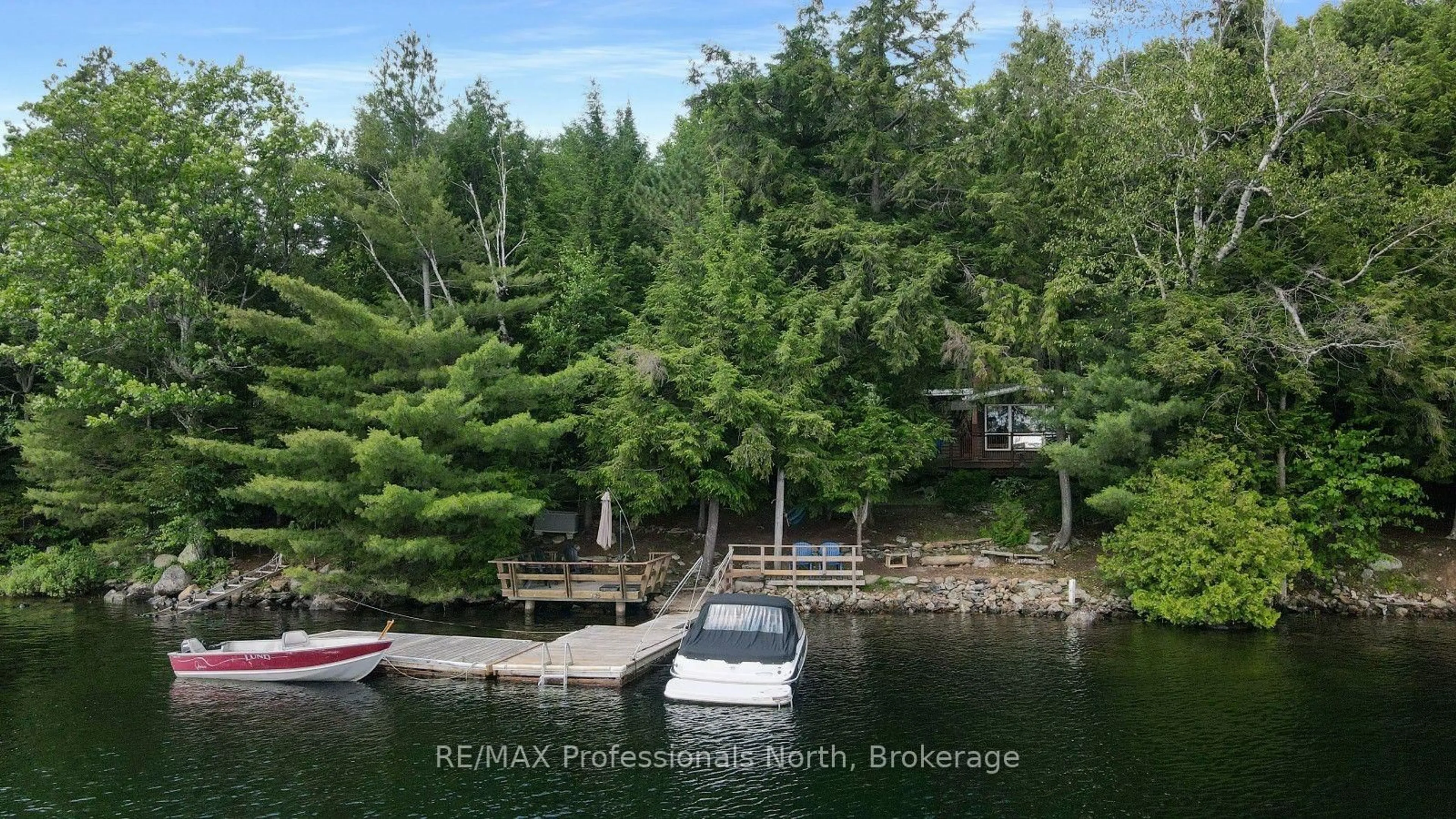 A pic from outside/outdoor area/front of a property/back of a property/a pic from drone, water/lake/river/ocean view for 1042 Platinum Bay Rd, Dysart et al Ontario K0M 1S0