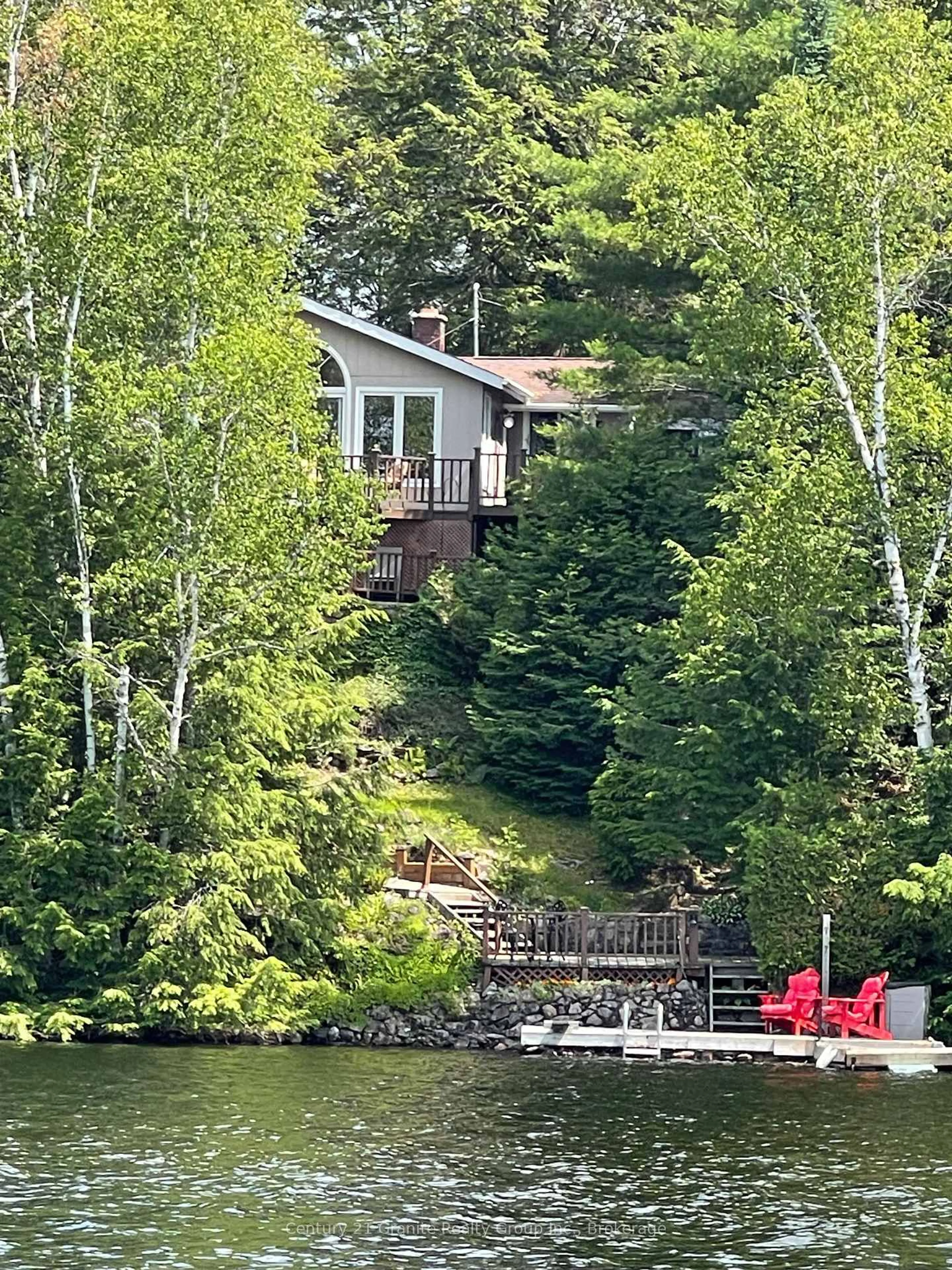 A pic from outside/outdoor area/front of a property/back of a property/a pic from drone, water/lake/river/ocean view for 1109 Burnt Point Tr, Highlands East Ontario K0M 2K0