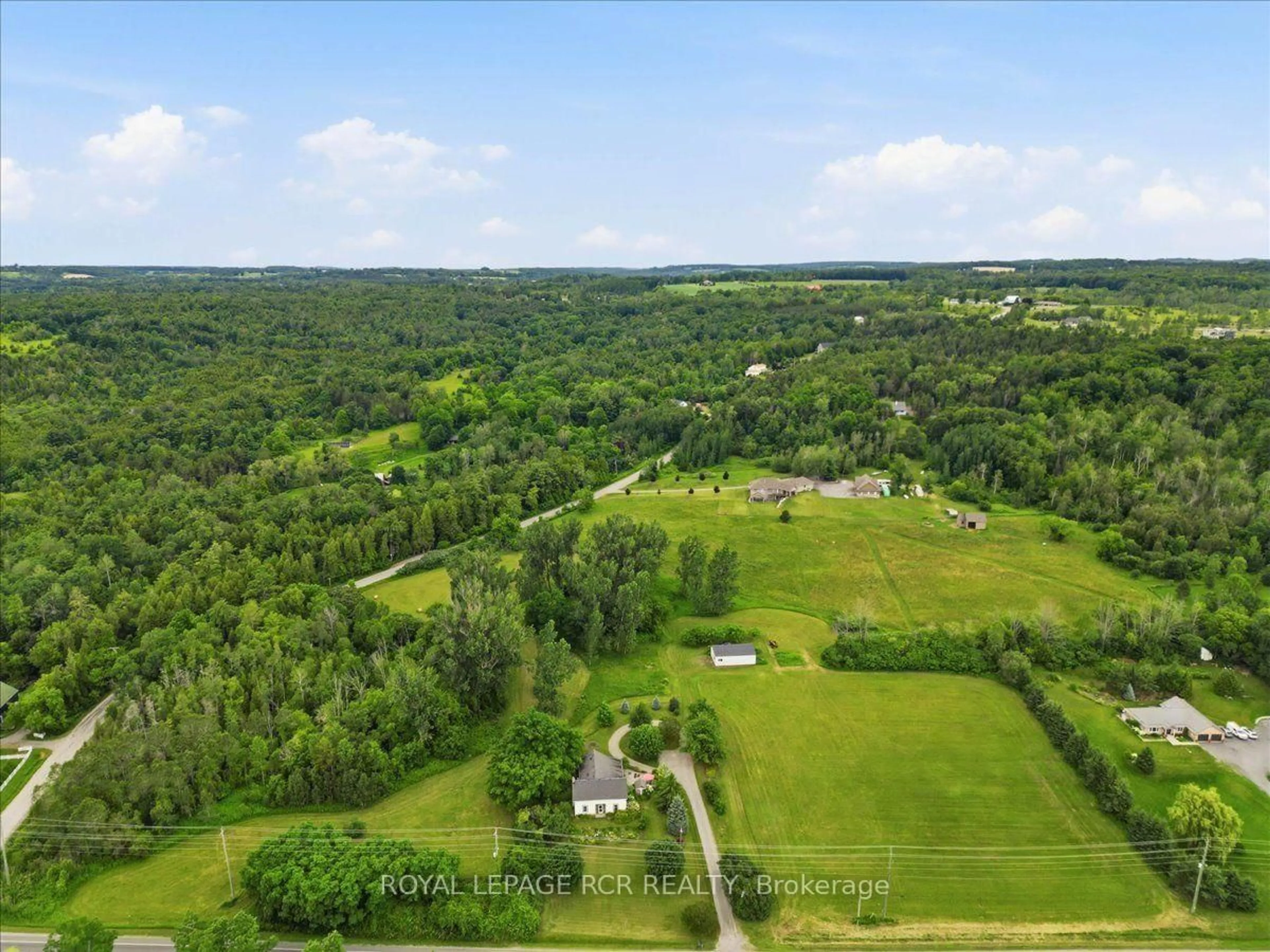 A pic from outside/outdoor area/front of a property/back of a property/a pic from drone, forest/trees view for 14116 County Road #2 Rd, Cramahe Ontario K0K 1H0
