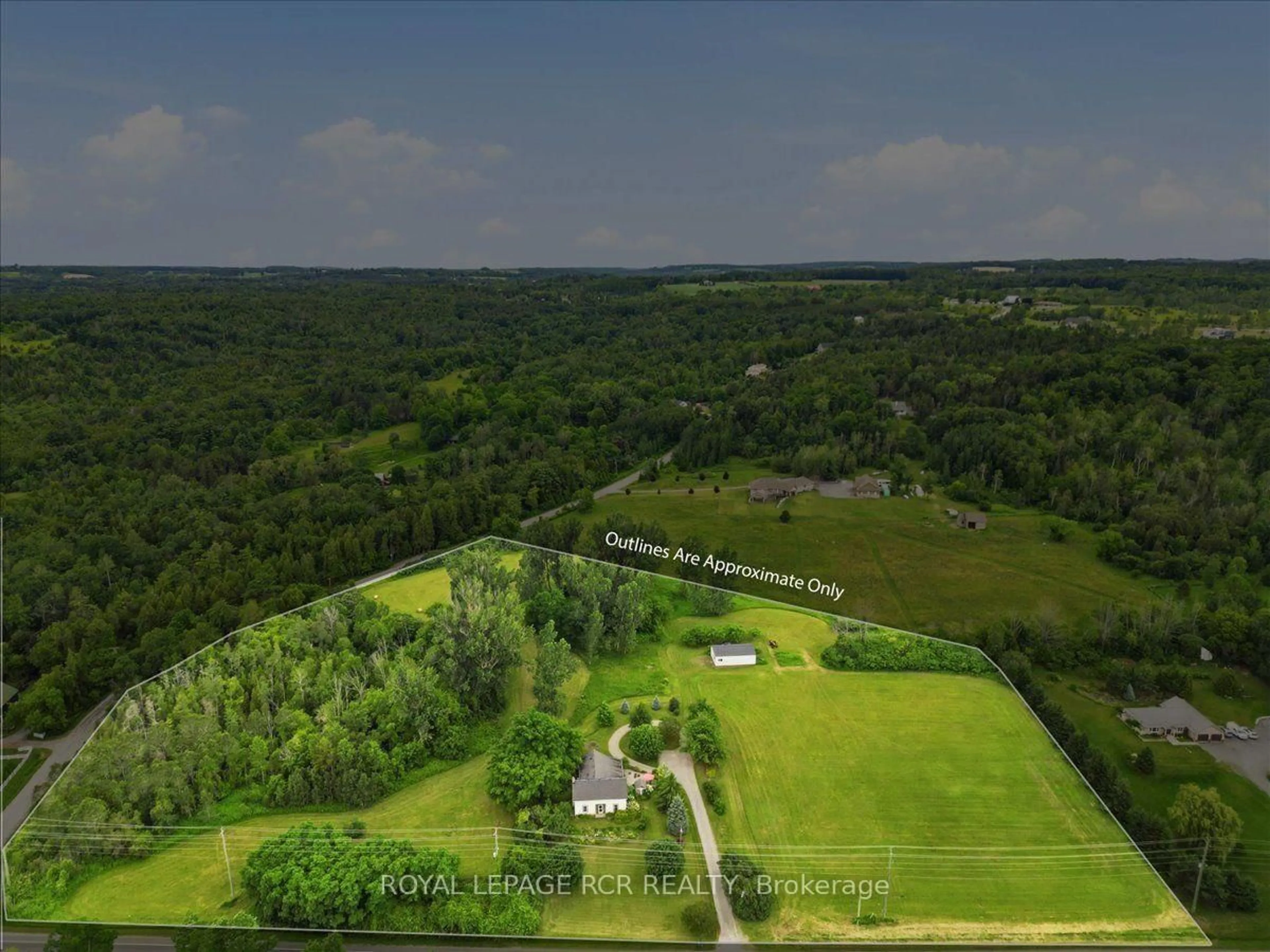 A pic from outside/outdoor area/front of a property/back of a property/a pic from drone, forest/trees view for 14116 County Road #2 Rd, Cramahe Ontario K0K 1H0
