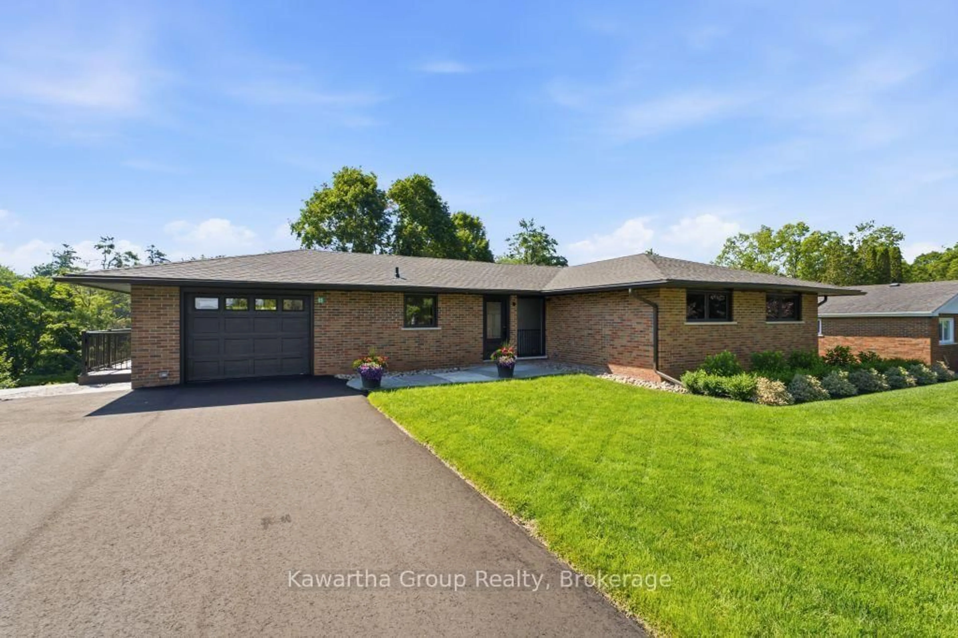 Home with brick exterior material, street for 65 Grandy Rd, Kawartha Lakes Ontario K0M 1K0
