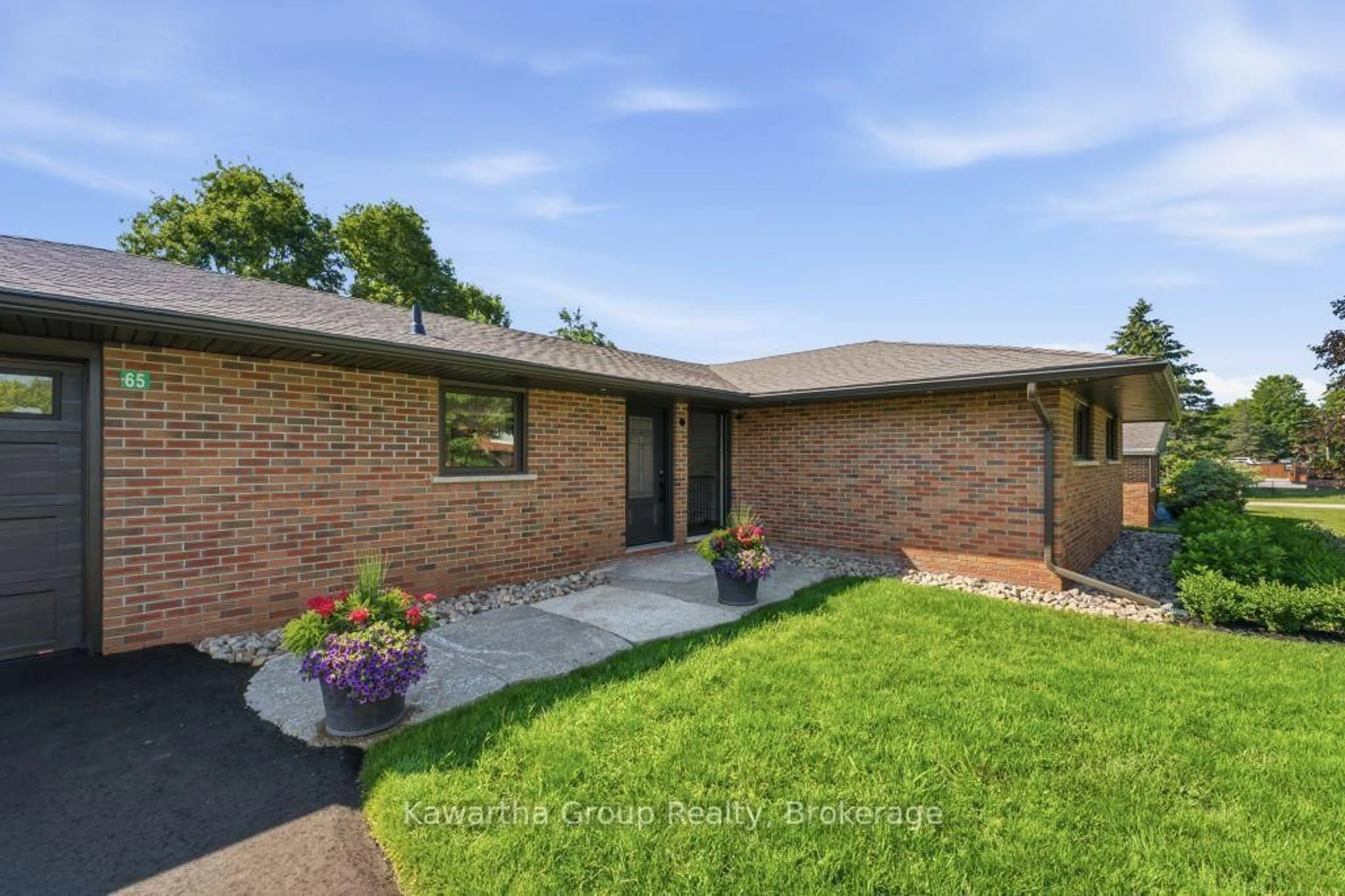 Home with brick exterior material, street for 65 Grandy Rd, Kawartha Lakes Ontario K0M 1K0