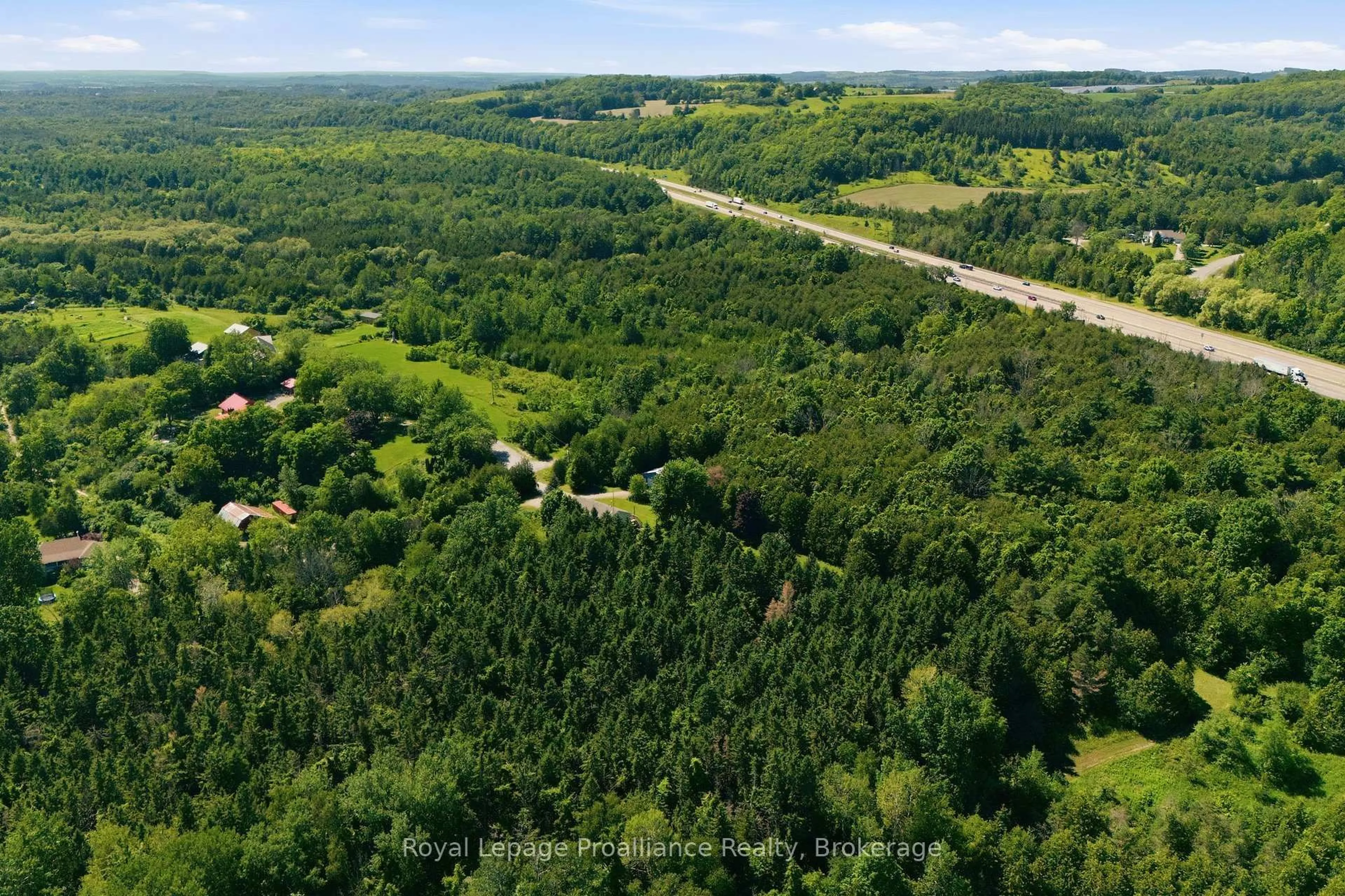 A pic from outside/outdoor area/front of a property/back of a property/a pic from drone, forest/trees view for 2103 Ron Harnden Rd, Cobourg Ontario K9A 4J8