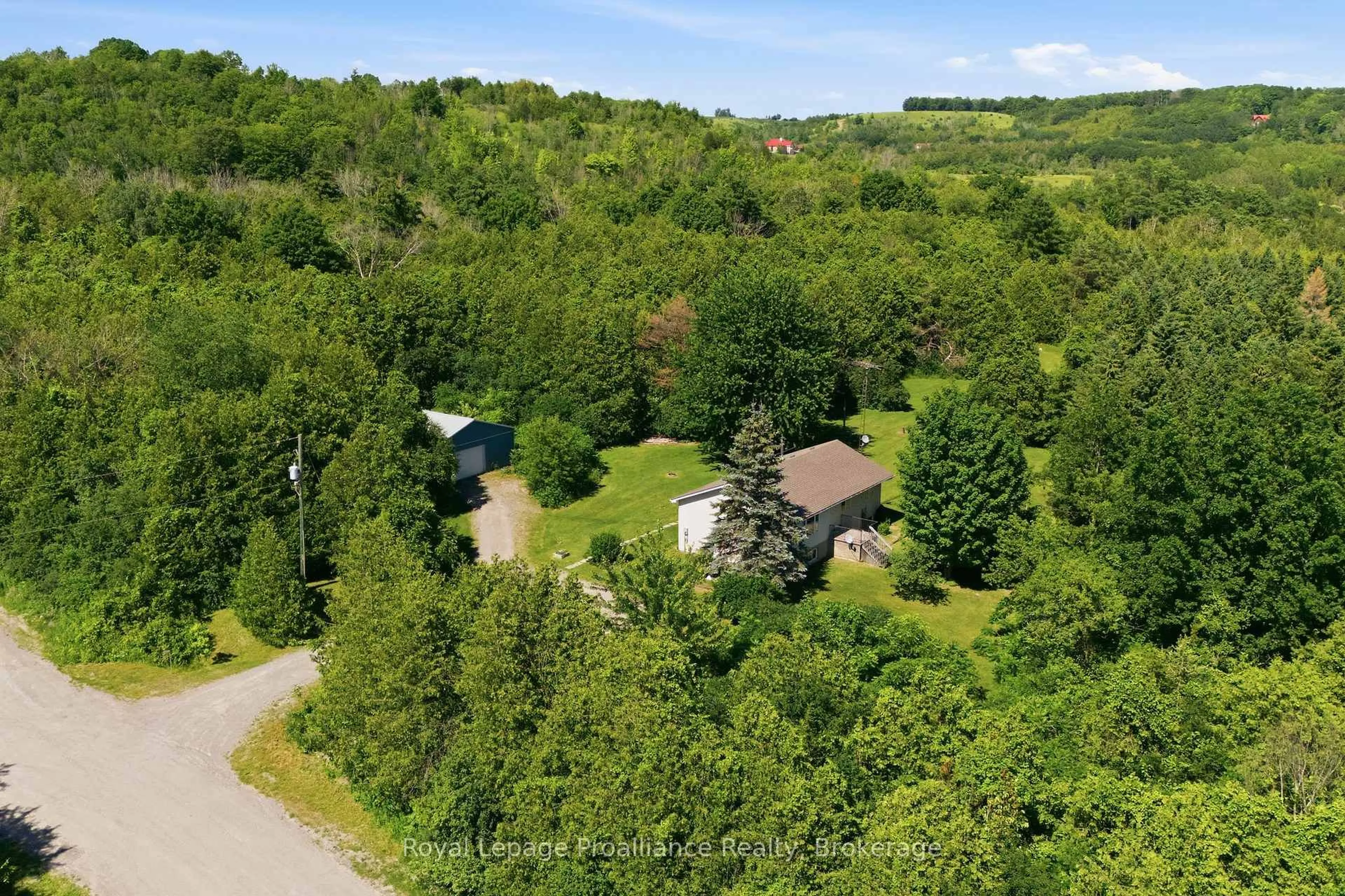 A pic from outside/outdoor area/front of a property/back of a property/a pic from drone, forest/trees view for 2103 Ron Harnden Rd, Cobourg Ontario K9A 4J8