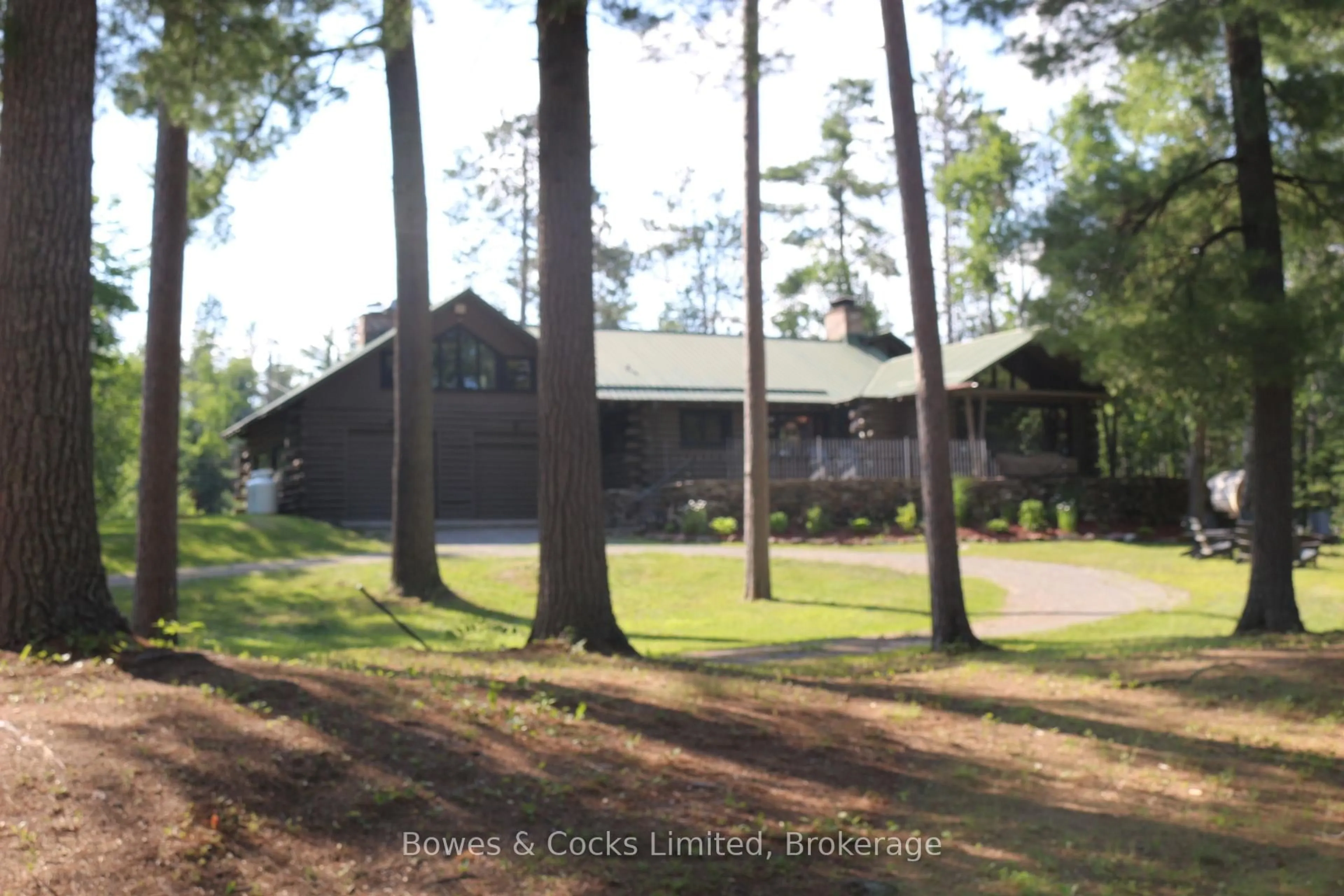 A pic from outside/outdoor area/front of a property/back of a property/a pic from drone, forest/trees view for 7953 Highway 28, North Kawartha Ontario K0L 3E0