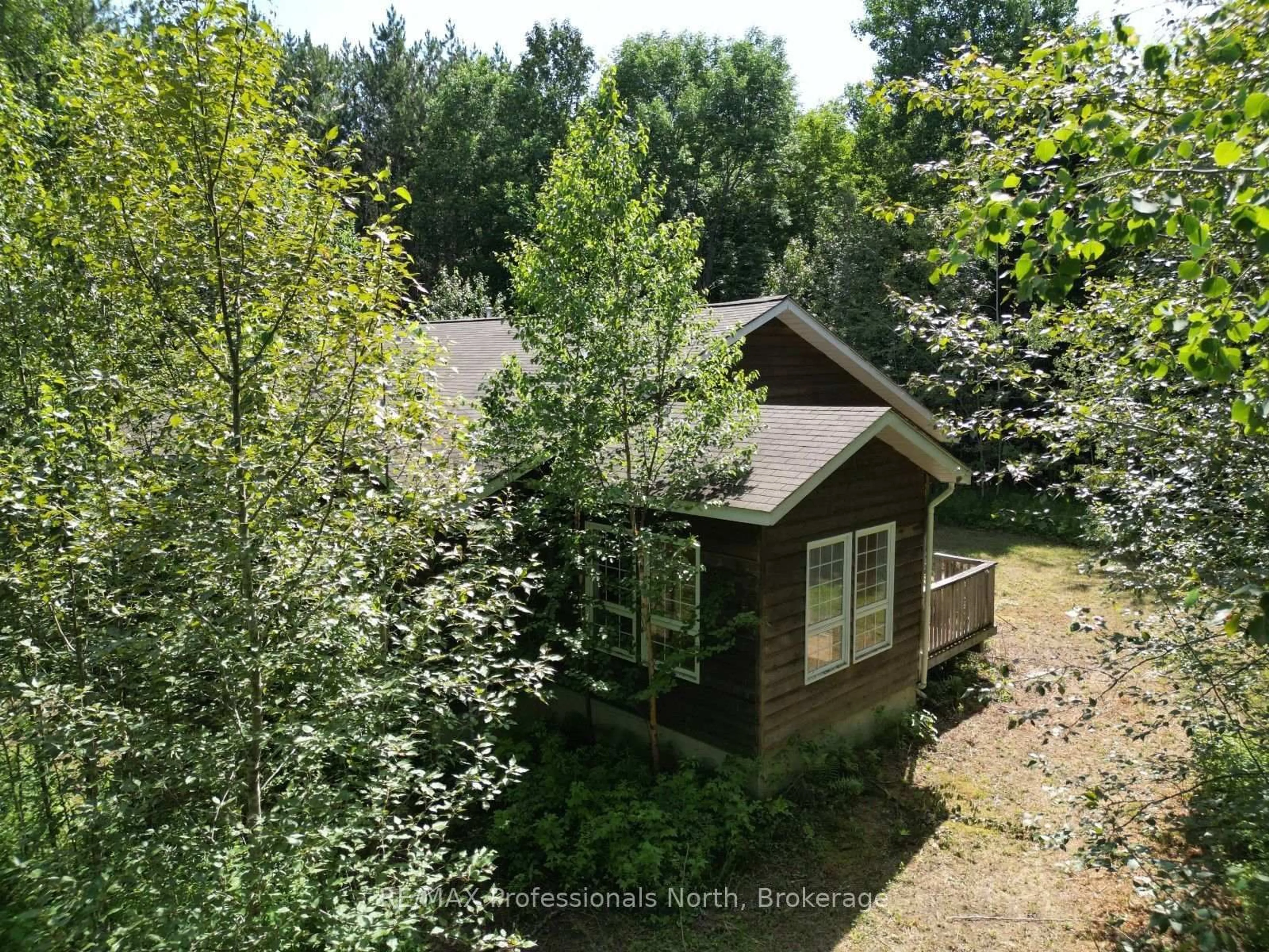 A pic from outside/outdoor area/front of a property/back of a property/a pic from drone, forest/trees view for 1170 Bushwolf Lake Rd, Dysart et al Ontario K0M 1S0