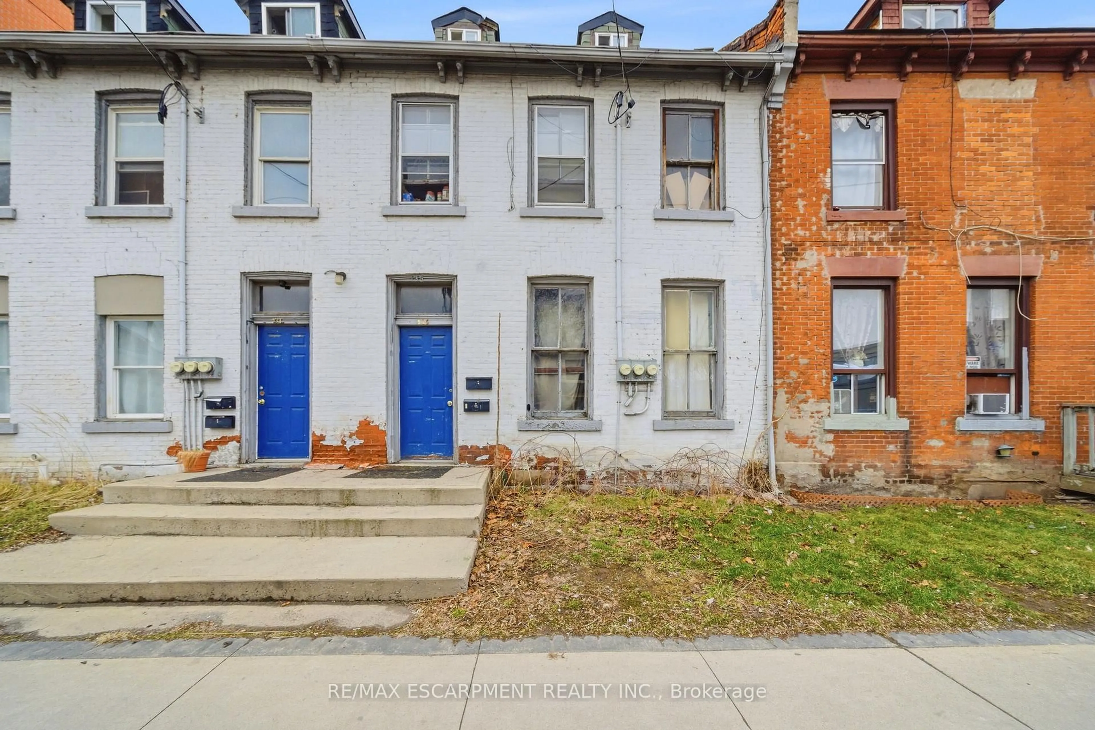 Home with brick exterior material, street for 133-135 Wellington St, Hamilton Ontario L8R 1N4