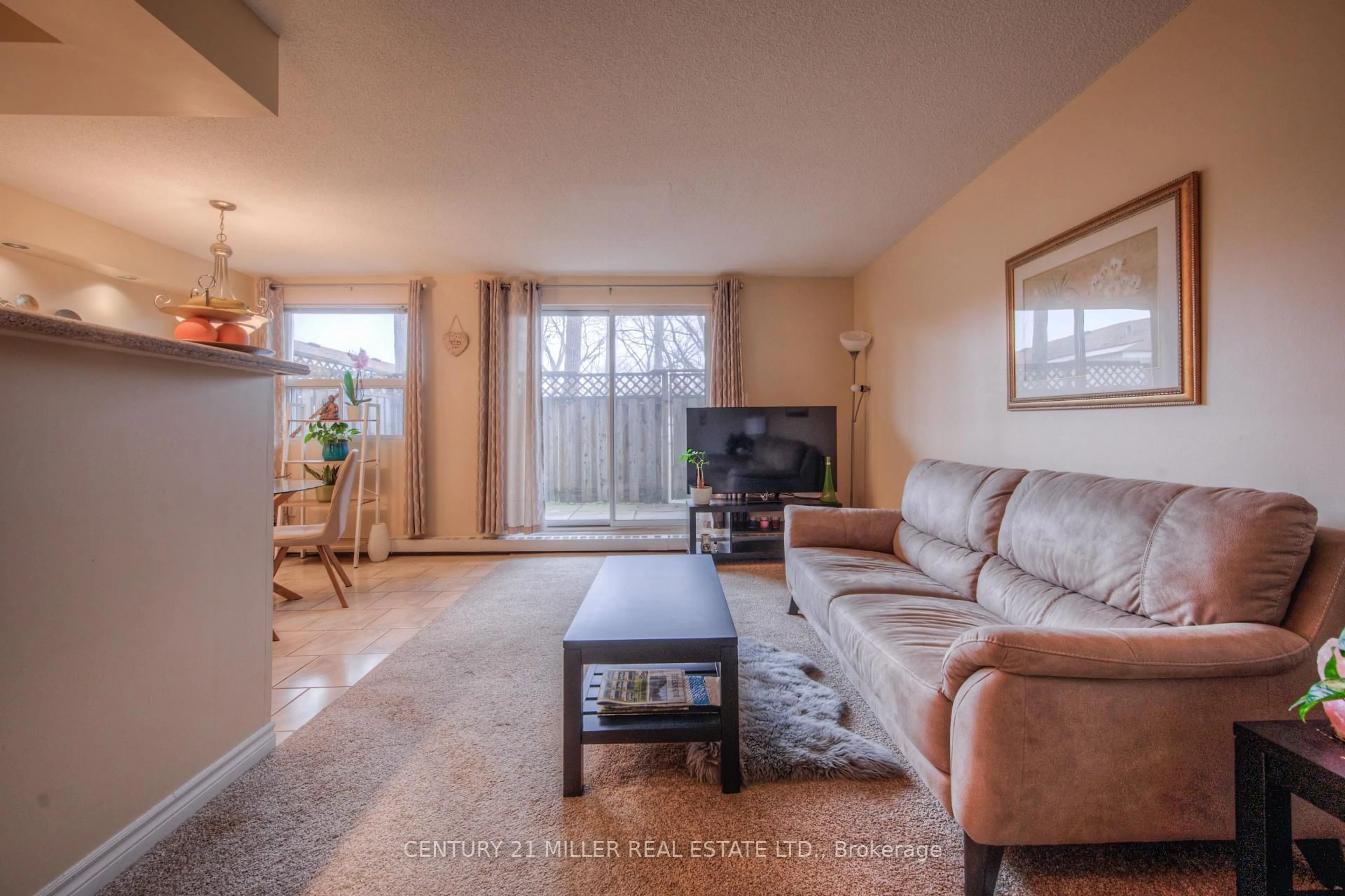 Living room with furniture, unknown for 793 Colborne St #110, Brantford Ontario N3S 7J3