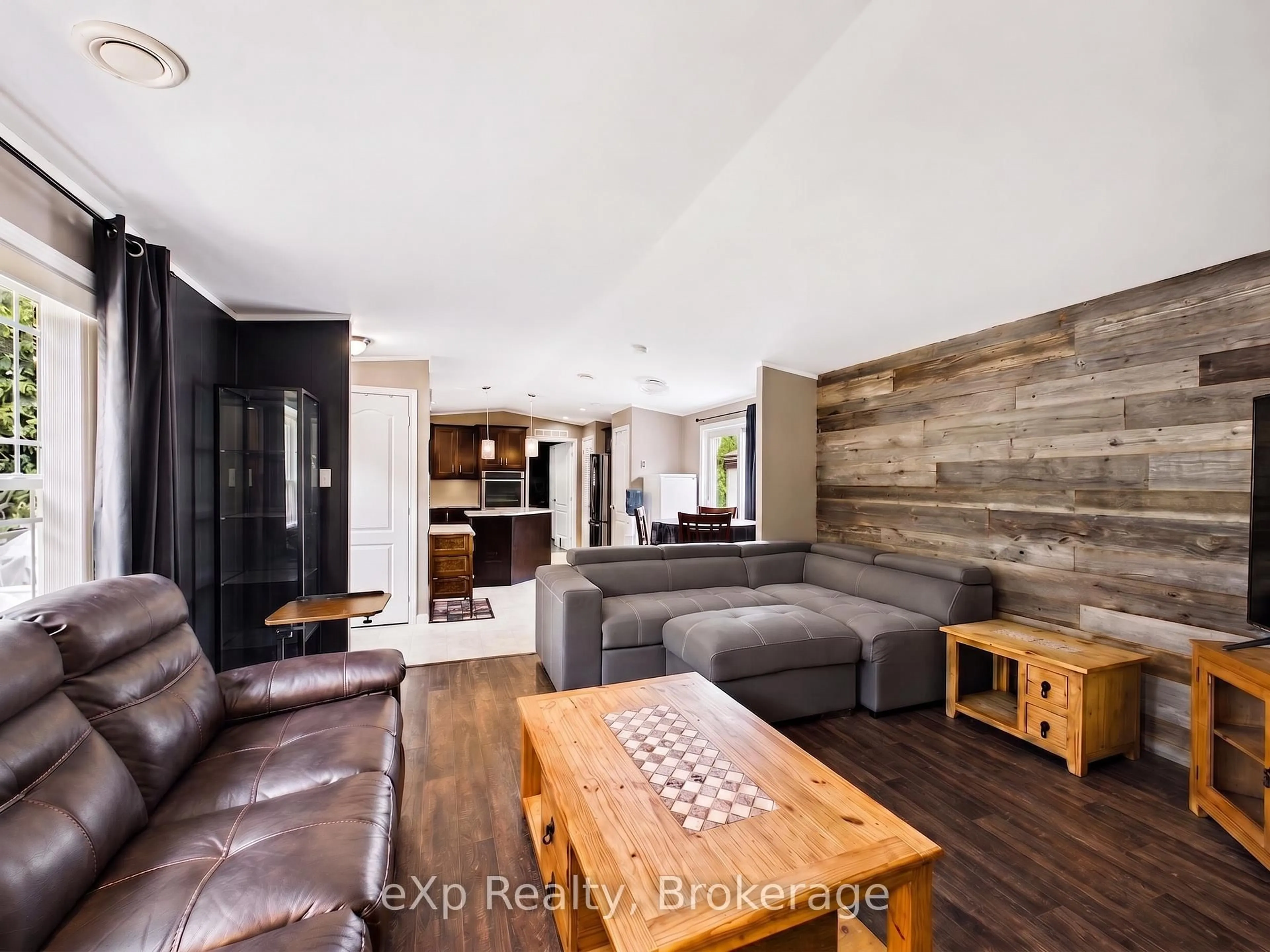 Living room with furniture, wood/laminate floor for 32 Maple Grove Village Rd, Southgate Ontario N0C 1B0