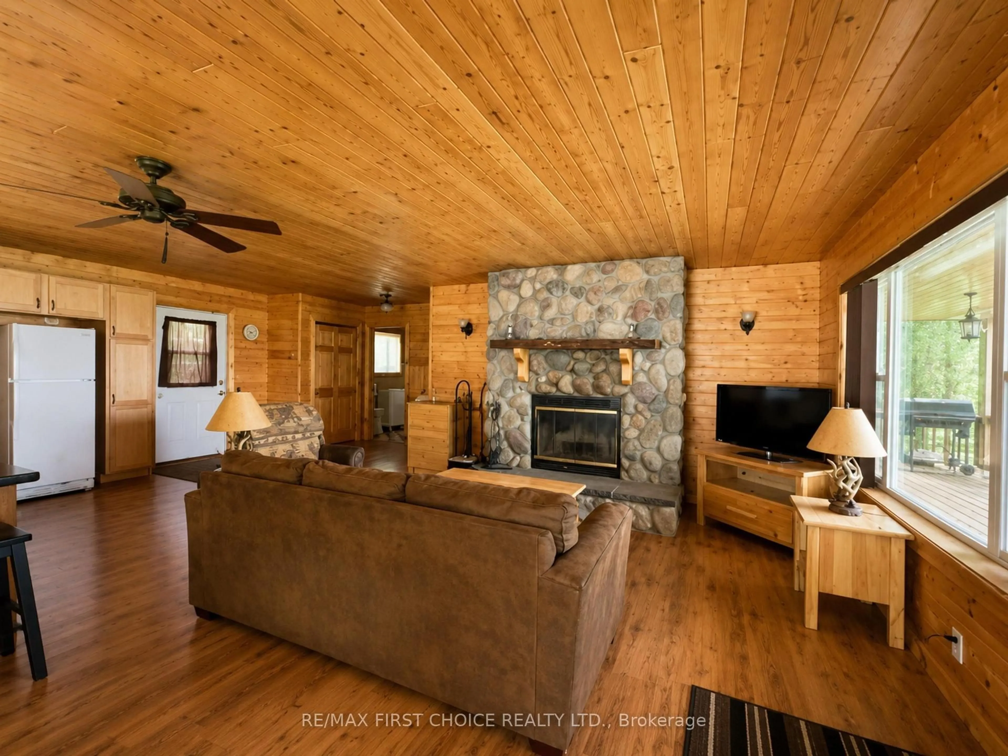 Living room with furniture, wood/laminate floor for D742 Dam Rd, Rainy River Remote Area Ontario P0W 1E0