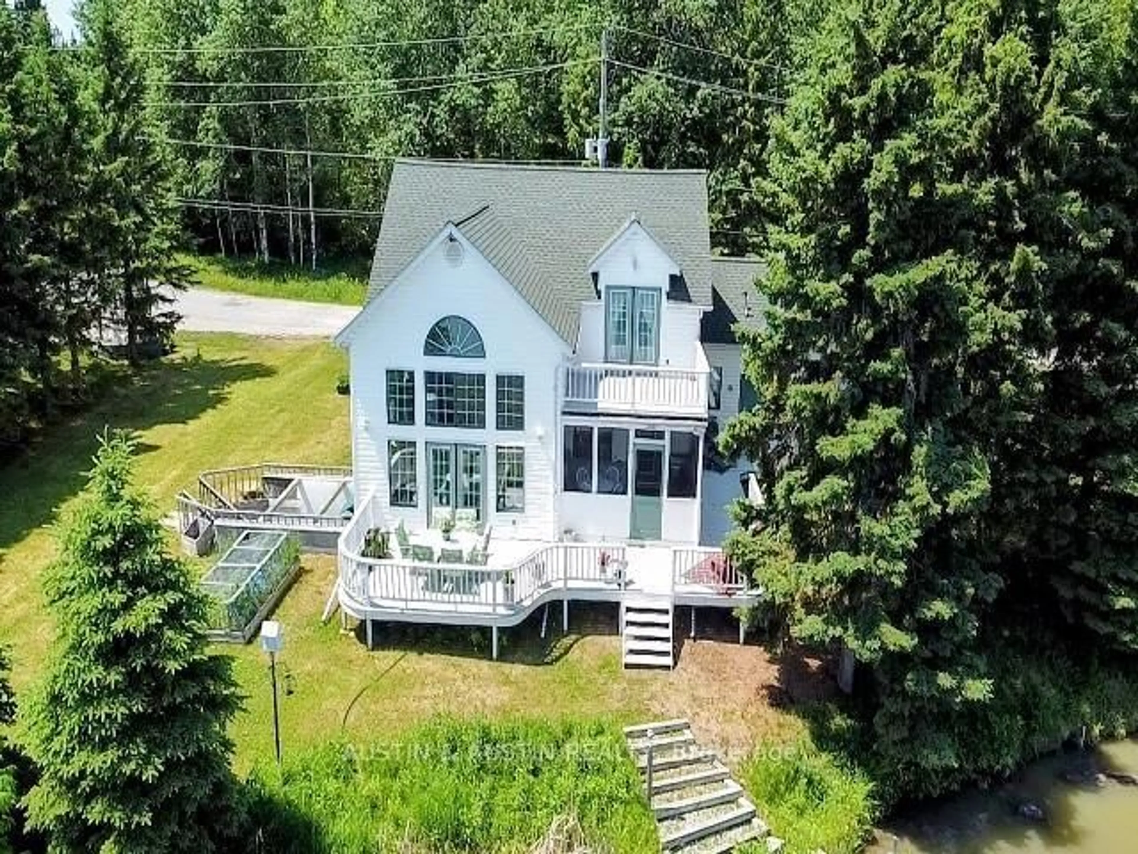 A pic from outside/outdoor area/front of a property/back of a property/a pic from drone, water/lake/river/ocean view for 227 West River Rd, Dryden Ontario P0V 2J0