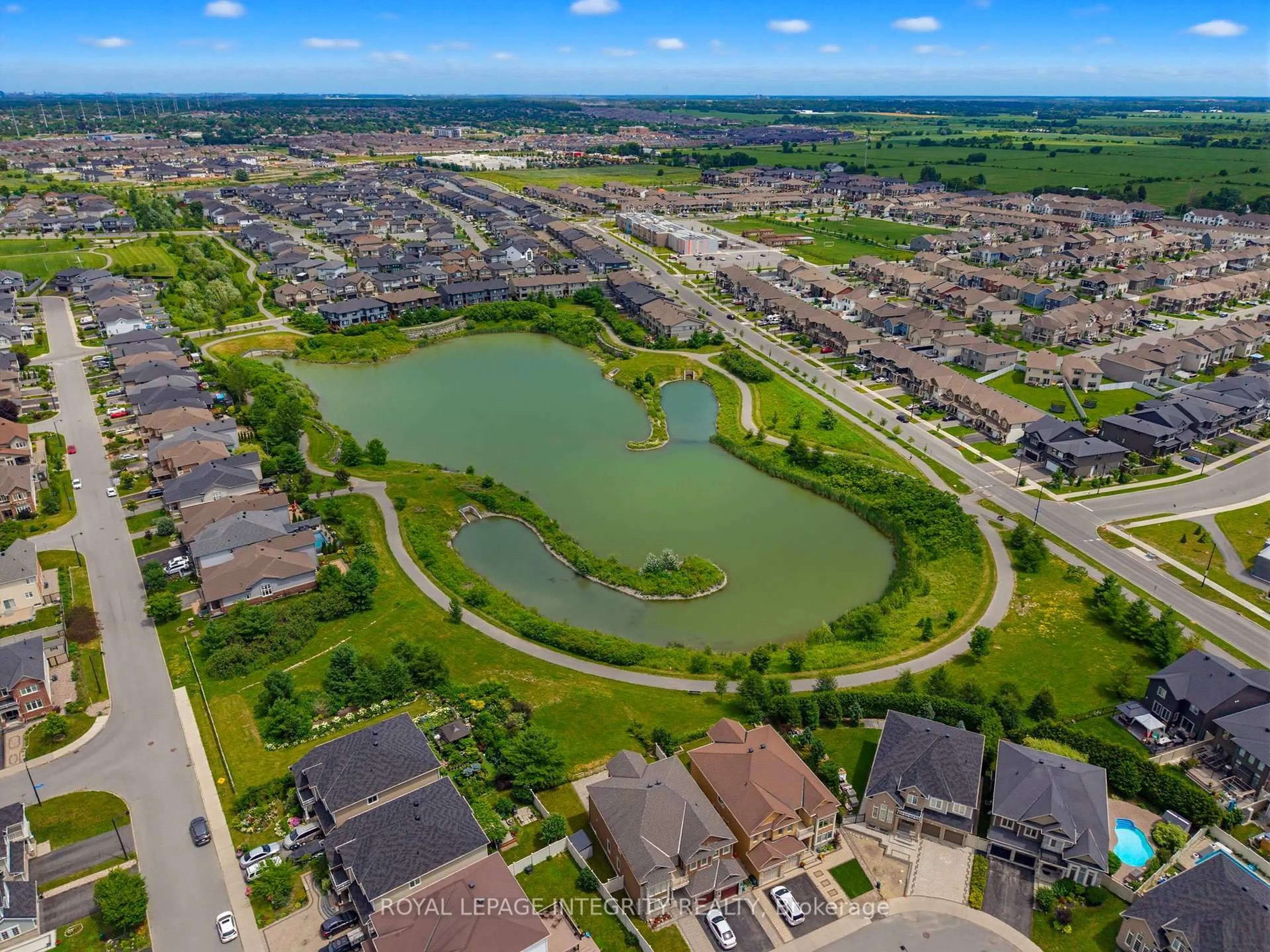 A pic from outside/outdoor area/front of a property/back of a property/a pic from drone, water/lake/river/ocean view for 319 Bobolink Rdge, Stittsville Ontario K2V 0B7