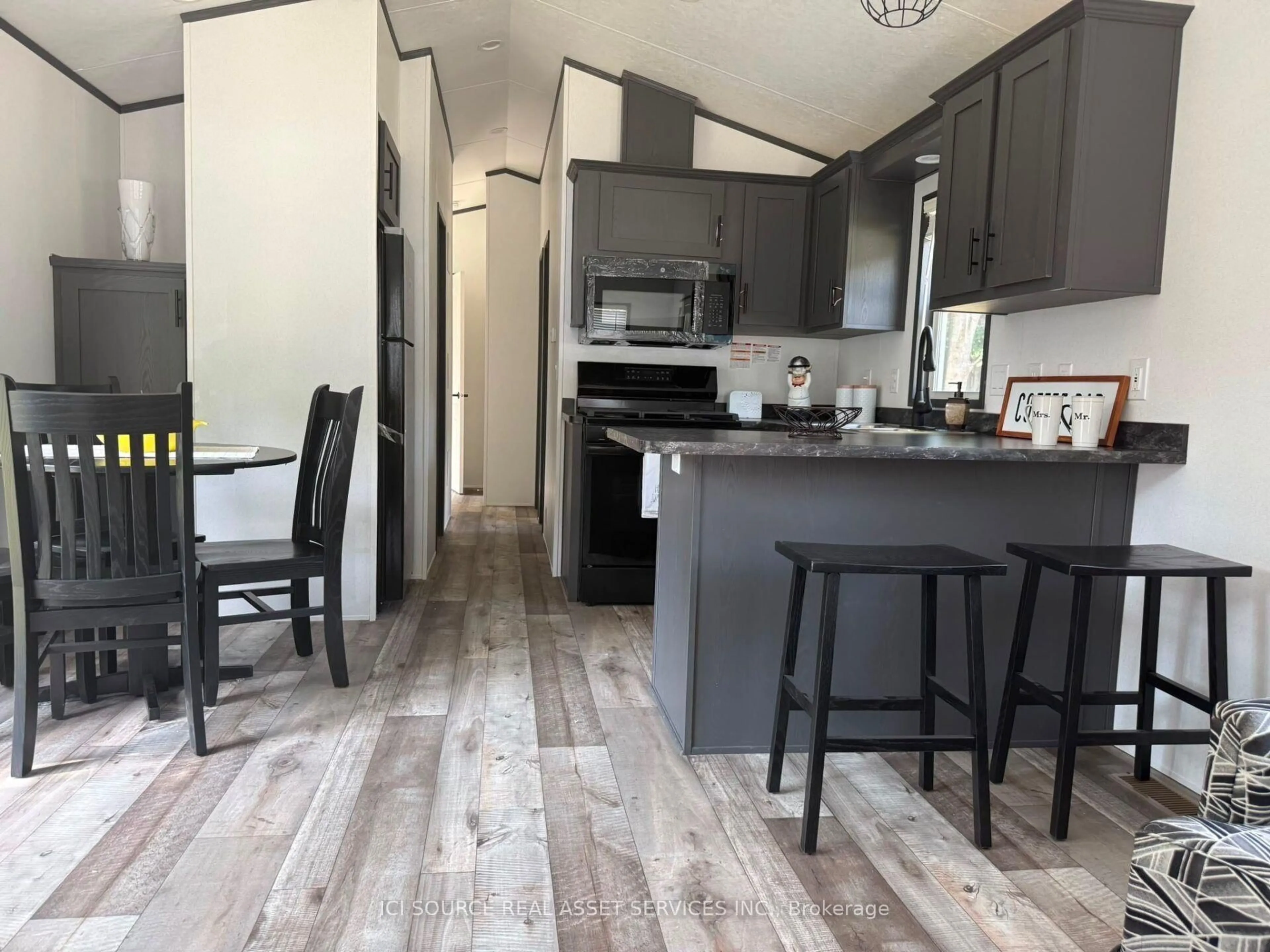Open concept kitchen, wood/laminate floor for 486 County Road 18 #HCBR01, Prince Edward County Ontario K0K 1P0