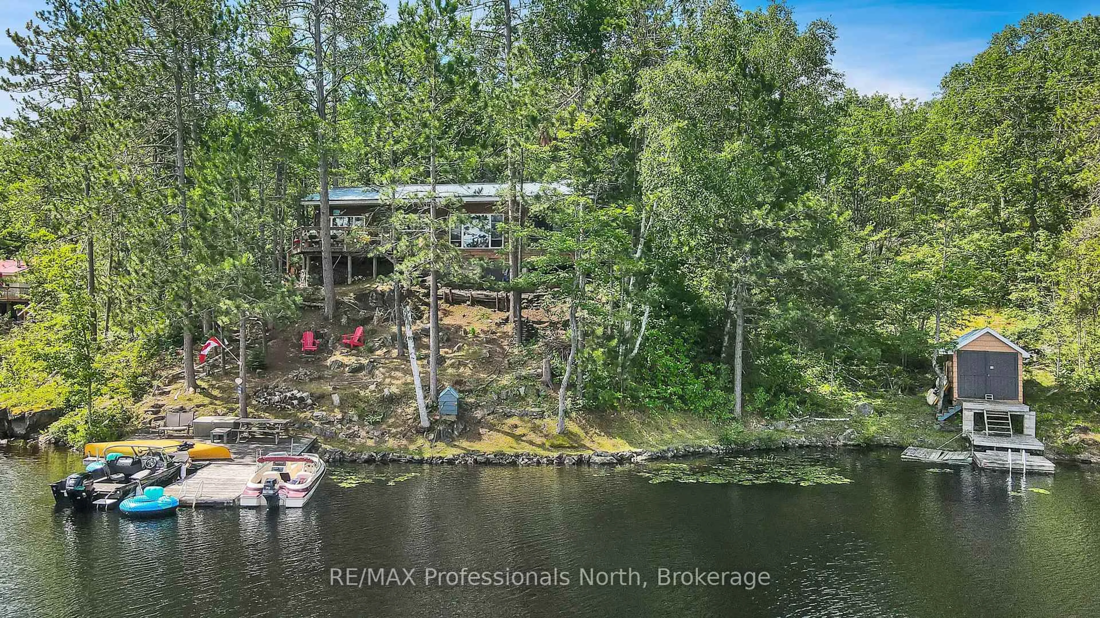 A pic from outside/outdoor area/front of a property/back of a property/a pic from drone, water/lake/river/ocean view for 10549 Devil's Lake WAO, Minden Hills Ontario K0M 2K0